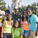 This Aug. 5, 2013 photo released by Disney shows Mickey Mouse posing with the Gaither quintuplets, standing from left, Renee Gaither-Williams, Joshua 