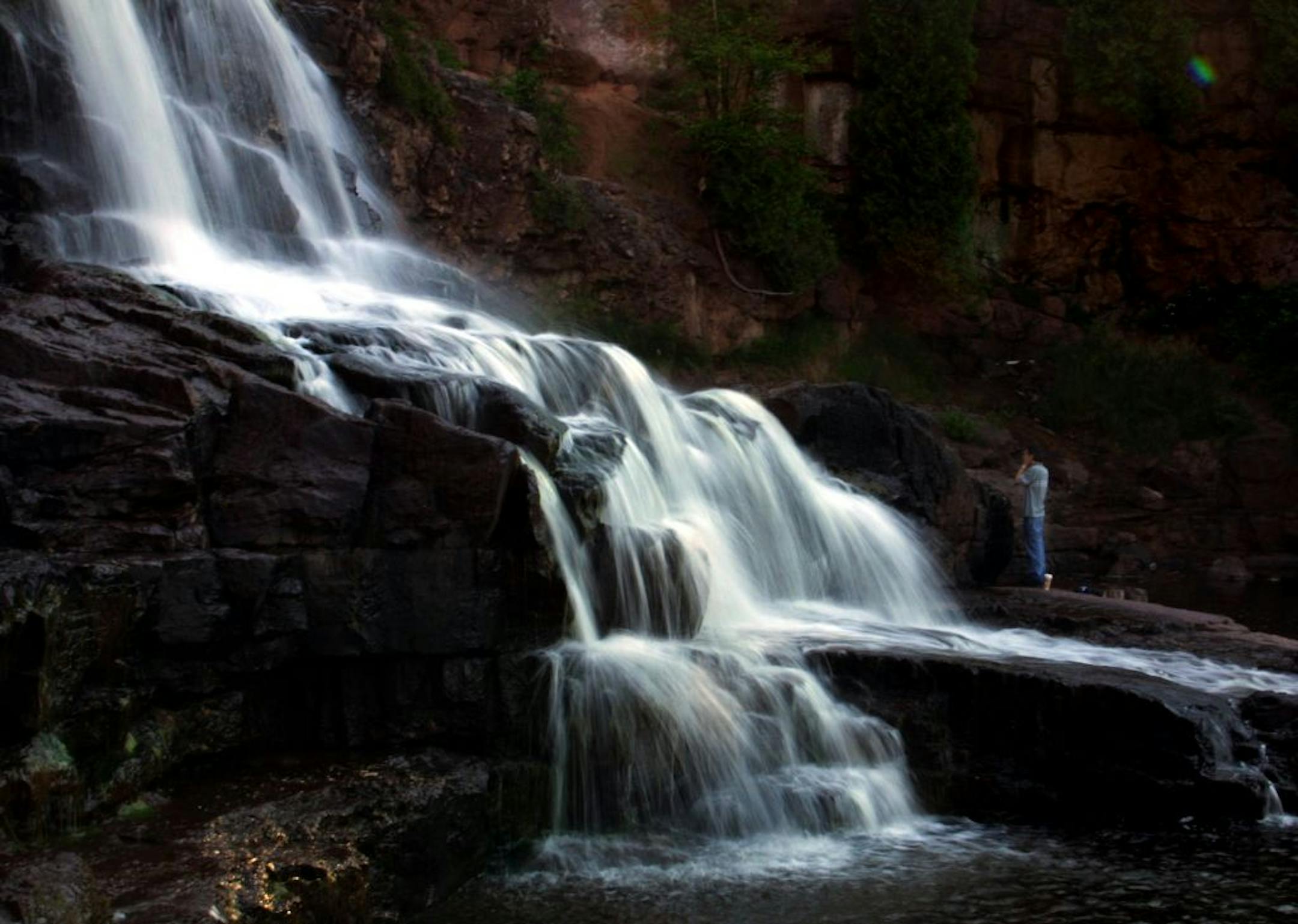 Gooseberry Falls State Park, MN Thurs 7/12/2001 What a way to wake up,,, Todd Anderson from Minneapolis, splashes the water from the falls on his face, as he and friend Steve Mishler taking a road trip, were the first to visit the falls early Thursday morning.