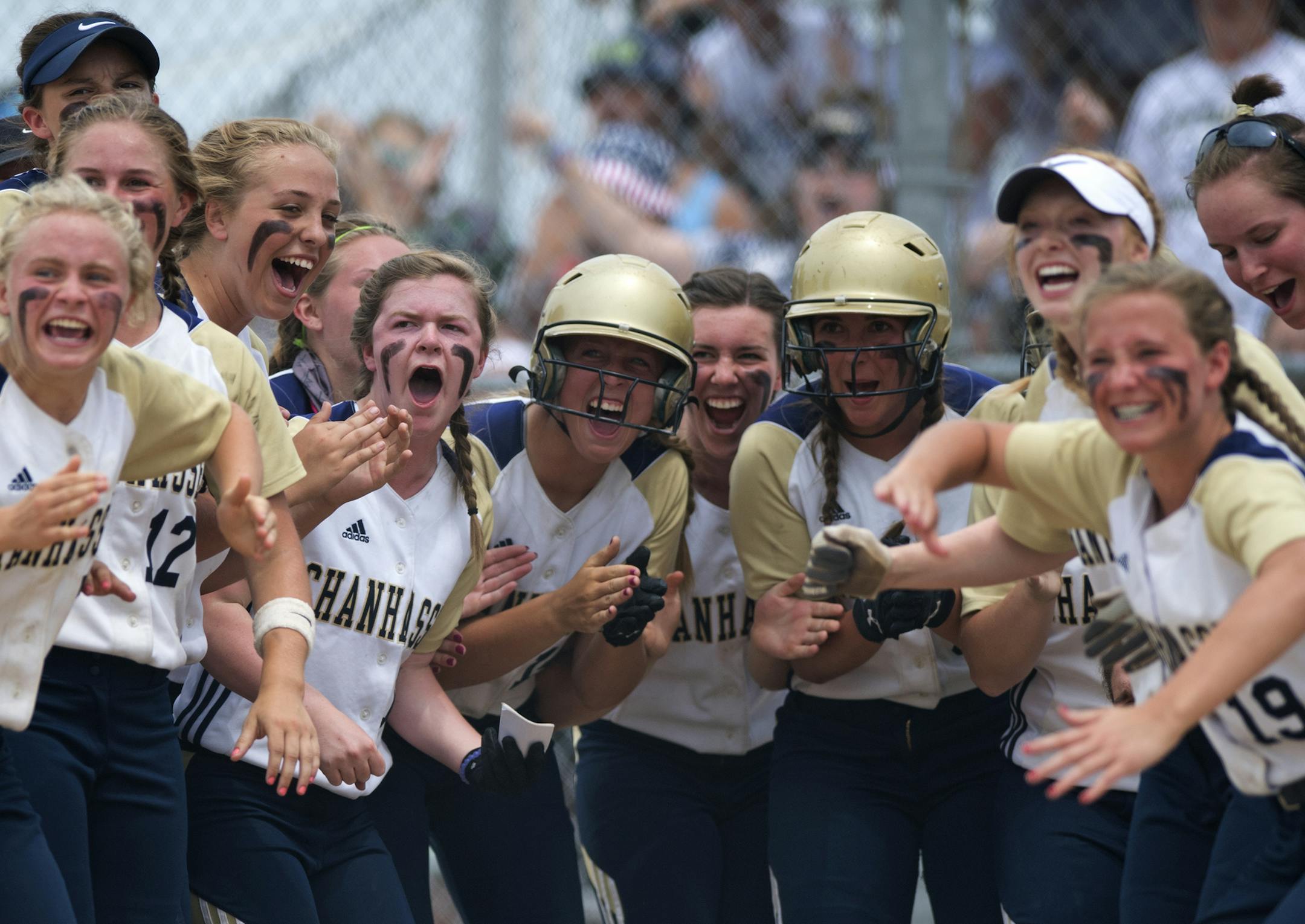Chanhassen players awaited catcher Jessica Bren at home plate after she hit a three-run homer in the first inning to pull ahead of Buffalo 3-0. Bren hit a state-leading 11 home runs. (Isaac Hale, Star Tribune)