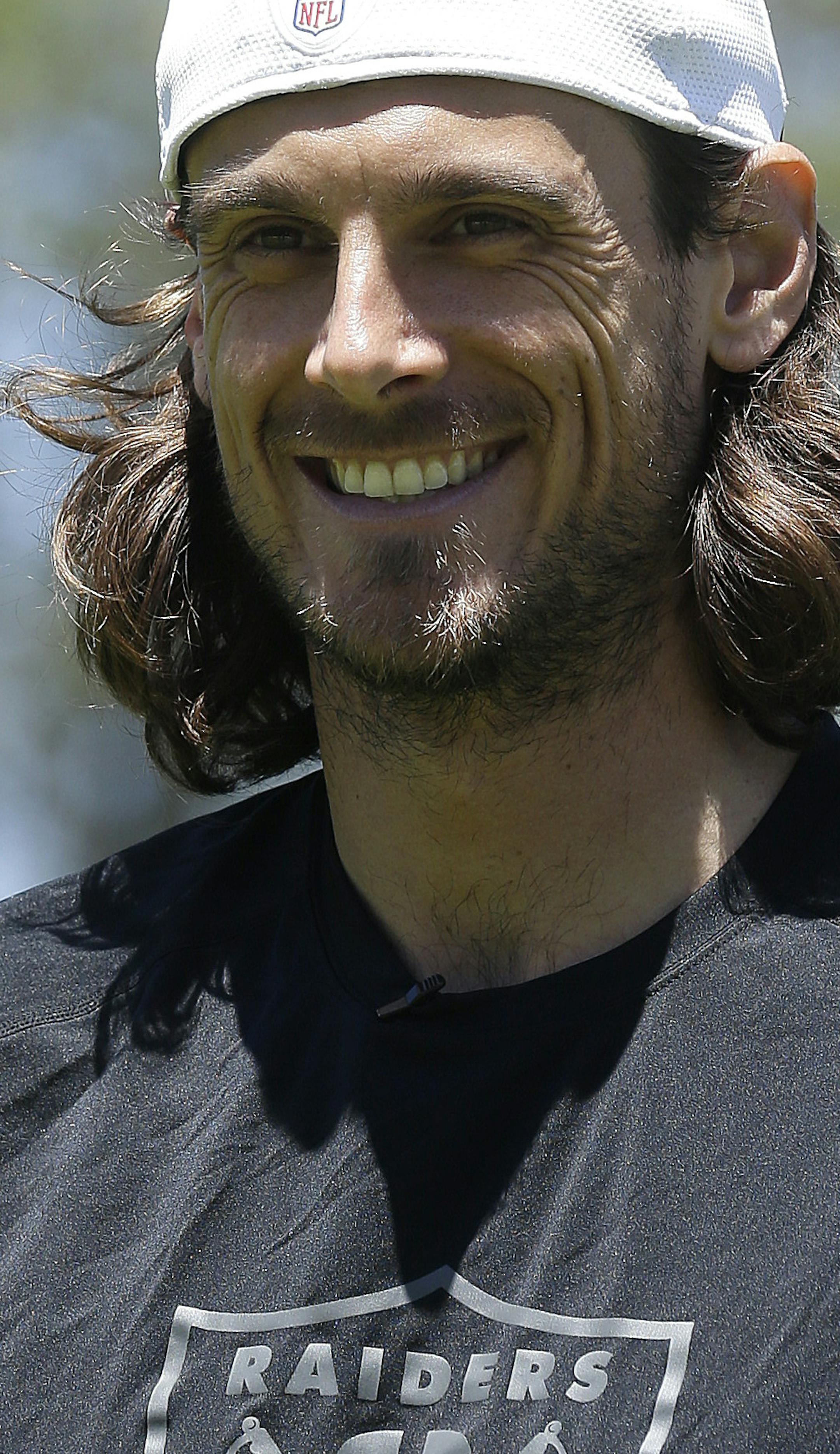 Oakland Raiders punter Chris Kluwe speaks to reporters after practice at an NFL football training camp in Alameda, Calif., Wednesday, June 12, 2013. (AP Photo/Jeff Chiu) ORG XMIT: MIN2013061813093344