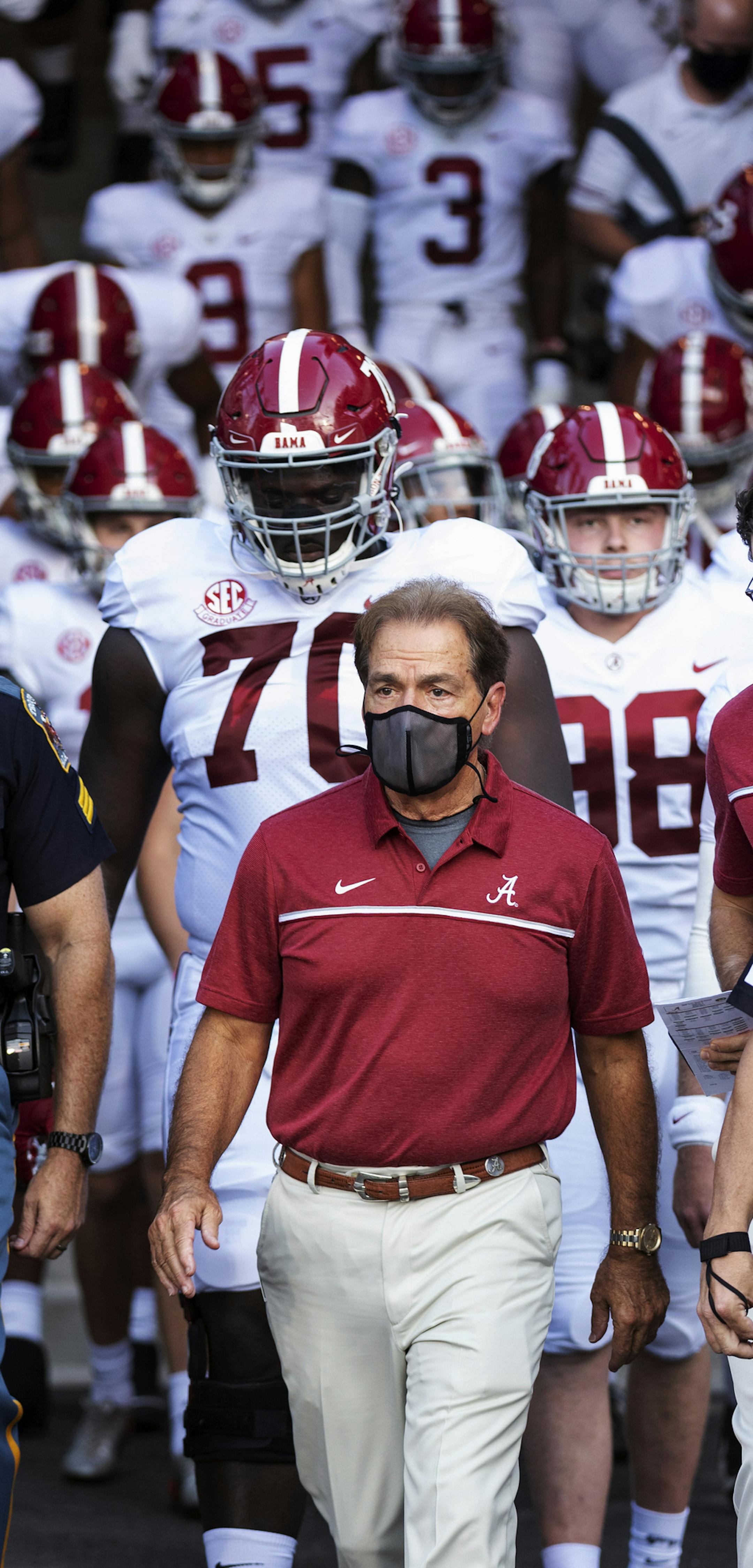 FILE - In this Sept. 26, 2020, file photo, Alabama coach Nick Saban leads his team to the field before an NCAA college football game against Missouri in Columbia, Mo. New Mississippi coach Lane Kiffin faces his old boss, Nick Saban, when the Rebels host No. 2 Alabama on Saturday. Saban last week improved to 20-0 when facing teams led by one of his former assistants. By(AP Photo/L.G. Patterson, File)