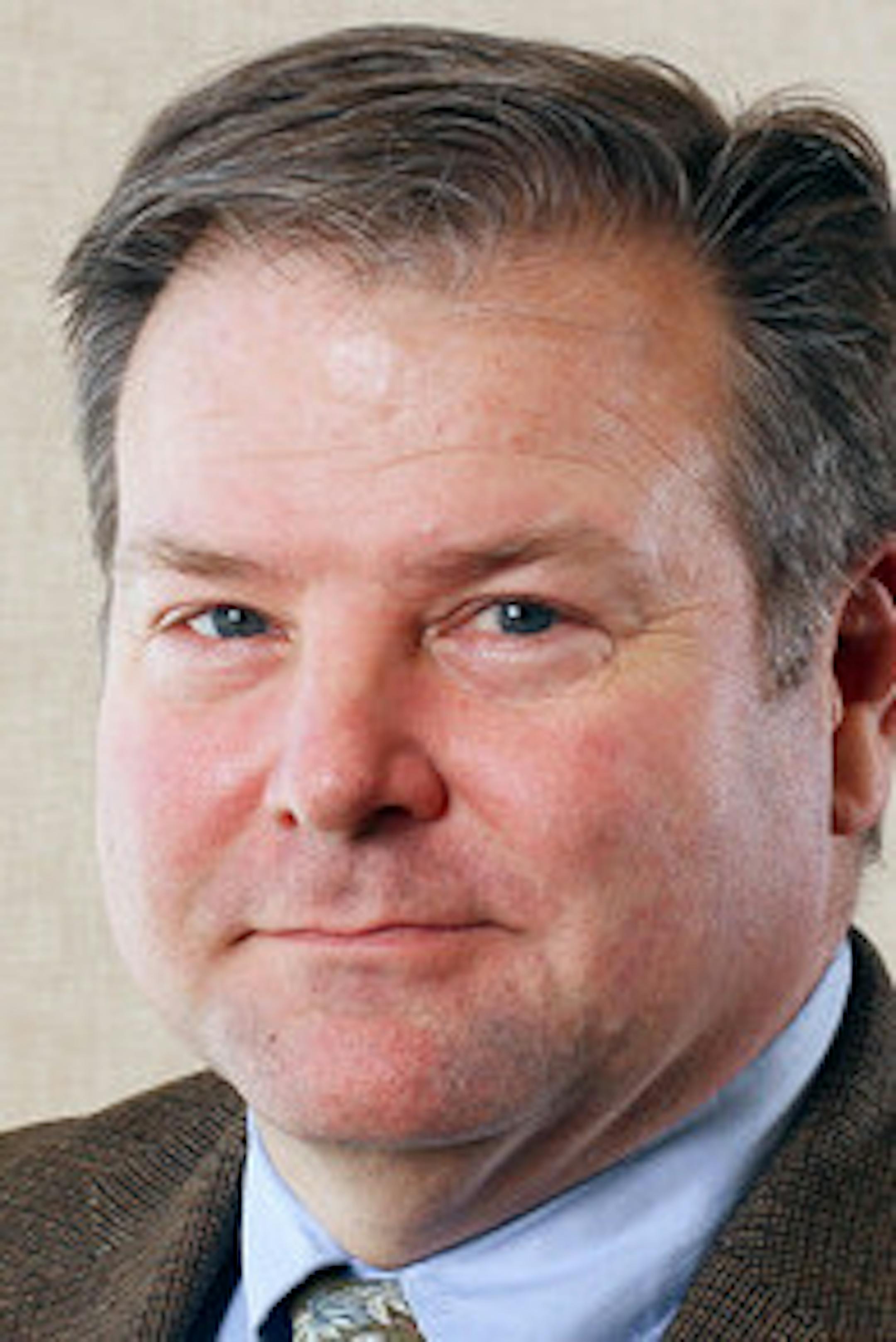 Environmental portrait of Mike Porter taken on Friday, March 8, 2013 on the St. Paul campus of the University of St. Thomas. ORG XMIT: MIN1411181529556585