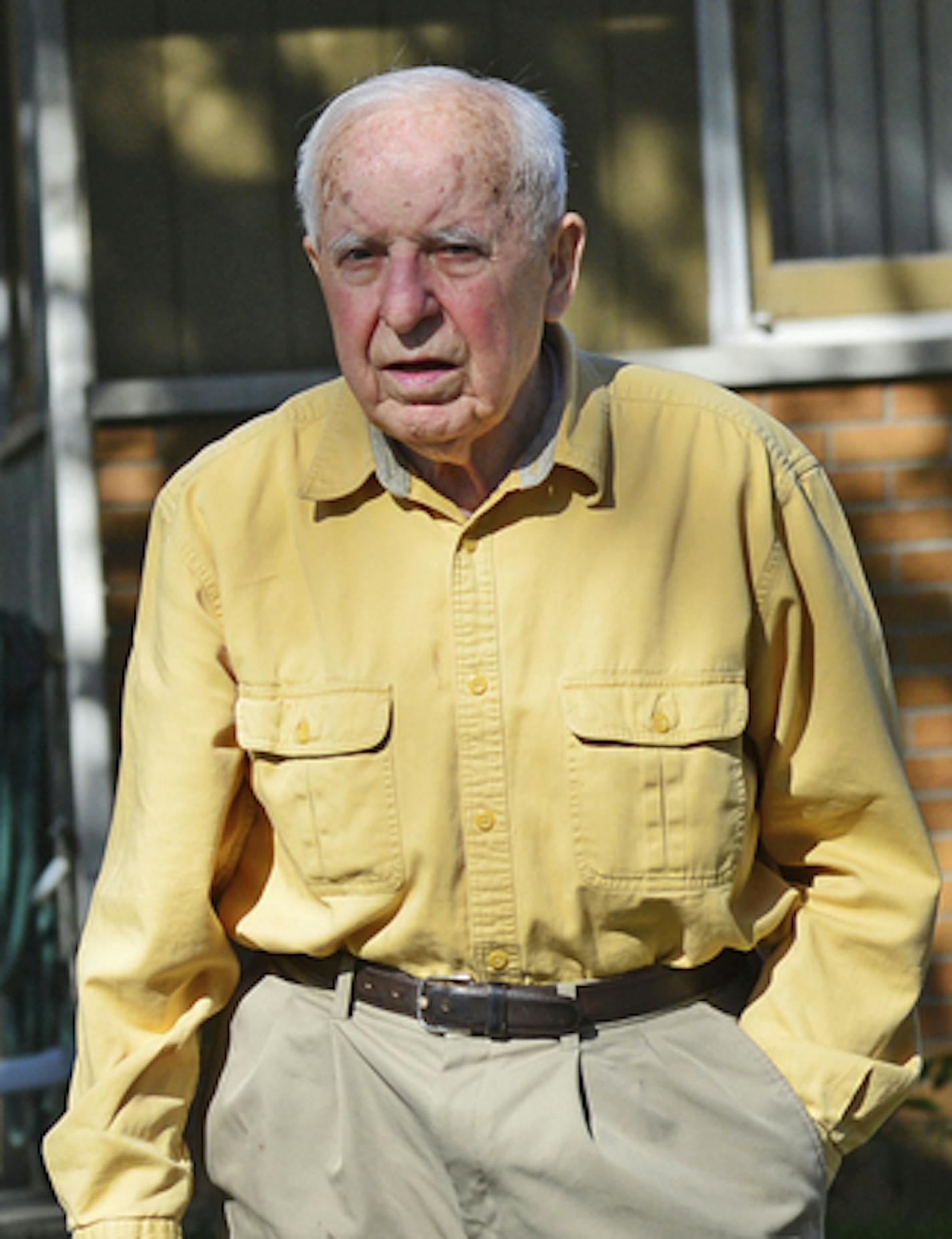 FILE - In this May 2014 file photo, Michael Karkoc works in his yard in Minneapolis. Karkoc, a retired Minnesota carpenter whom The Associated Press exposed as a former commander of a Nazi-led unit accused of war atrocities, died Dec. 14, 2019, according to cemetery and public records. He was 100. His family maintained that he was never a Nazi or committed any war crimes. (Richard Sennott/Star Tribune via AP)