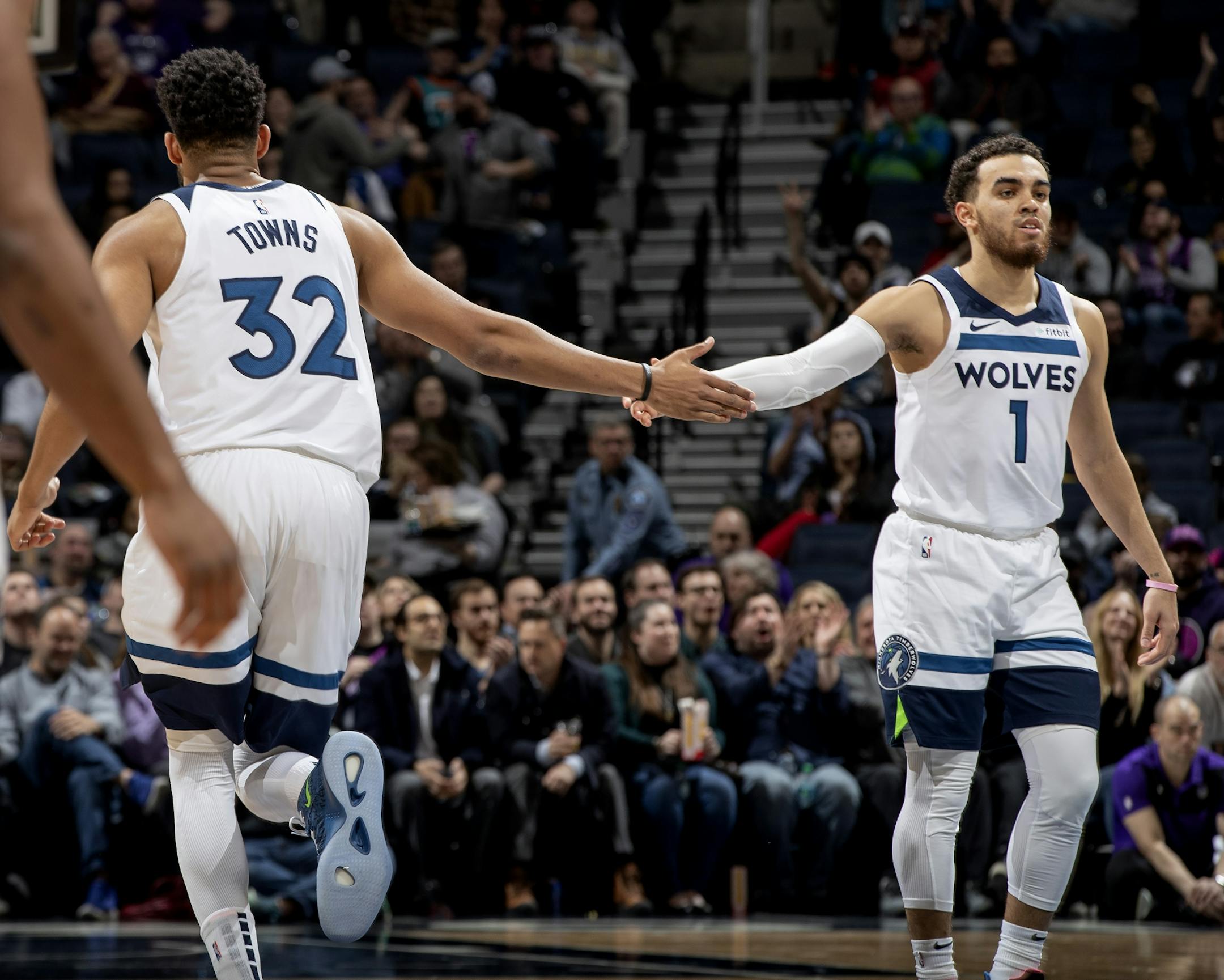 Karl-Anthony Towns and Tyus Jones in the first half.