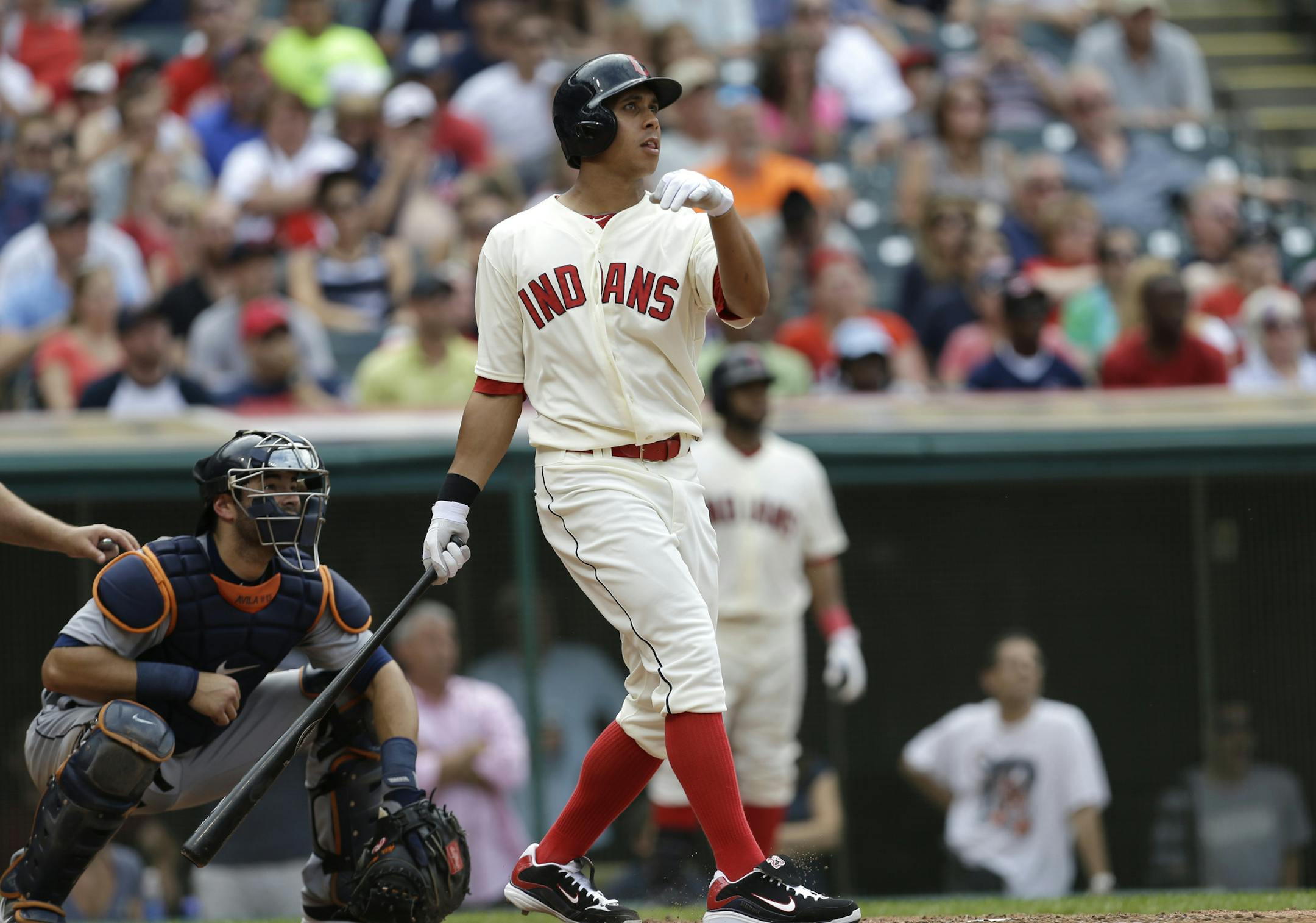 Cleveland Indians' Michael Brantley hits a two-run home run off Detroit Tigers relief pitcher Al Alburquerque in the eighth inning of a baseball game, Sunday, July 7, 2013, in Cleveland. Nick Swisher scored. Detroit Tigers catcher Alex Avila watches. (AP Photo/Tony Dejak)
