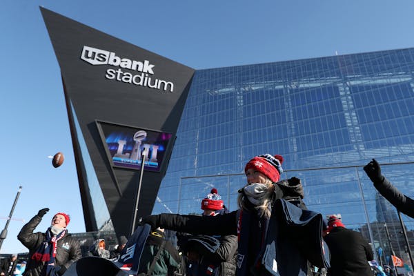 Patriots crew members passed out rally towels to fans as they entered U.S. Bank Stadium. ] ANTHONY SOUFFLE &#x2022; anthony.souffle@startribune.com Sc