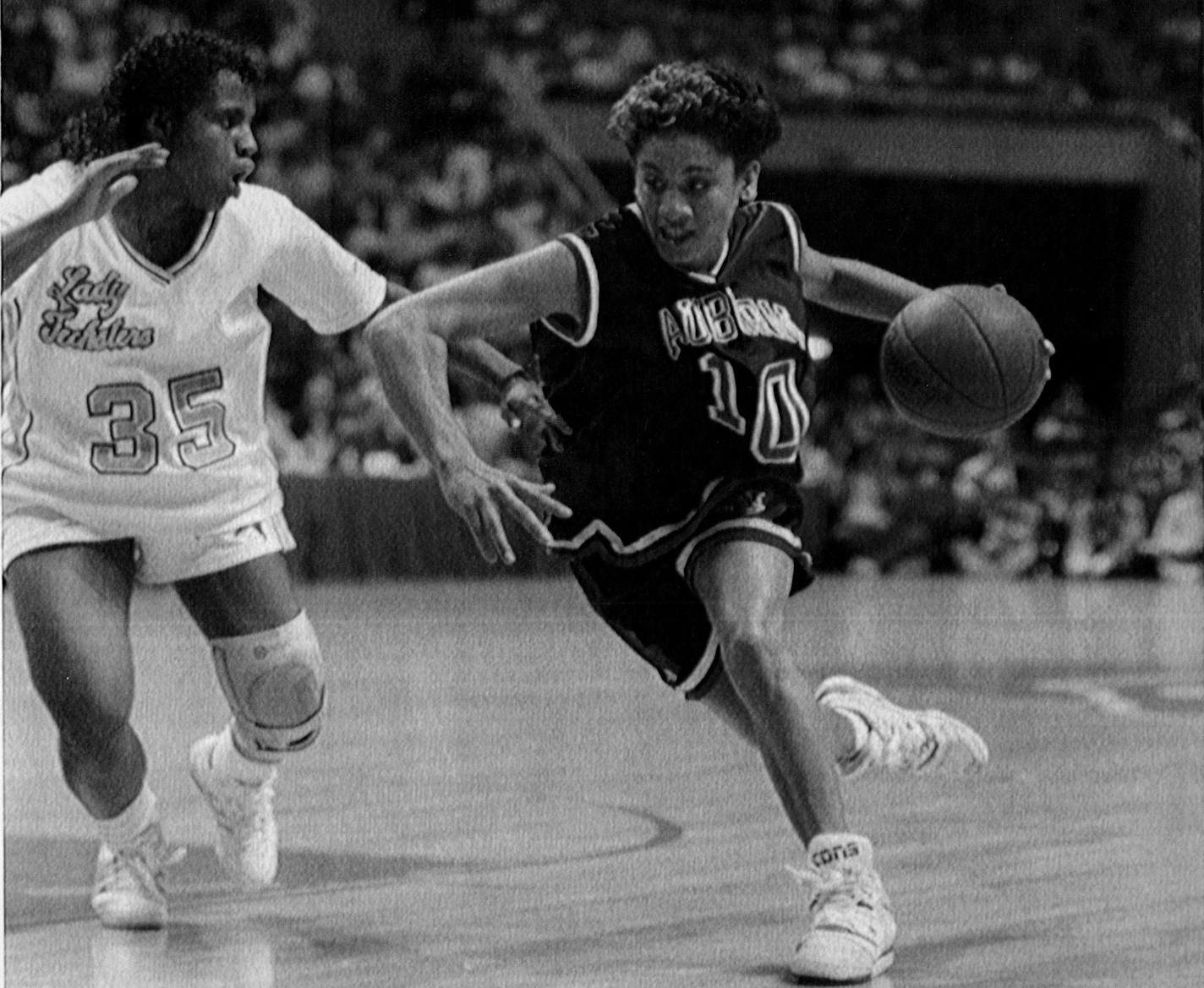 March 31, 1990 Driving Round - Chatel Tremitiere of Auburn moves past Pam Wells of Louisiana Tech during Auburn's 81-69 Semifinal win Friday night in the Women's NCAA Final Four Tournament in Knoxville. April 1, 1990 Bob Jordan, AP Laserphoto ORG XMIT: MIN2017012622151692