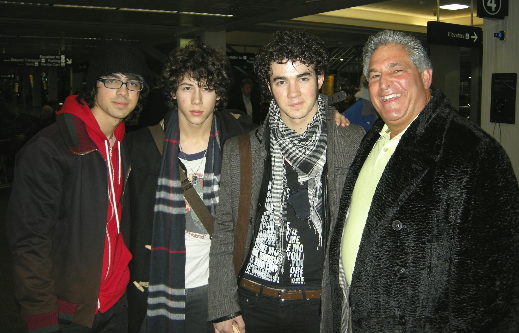 Steve Schussler with, from left: Joseph, Nicholas and Kevin Jonas.
