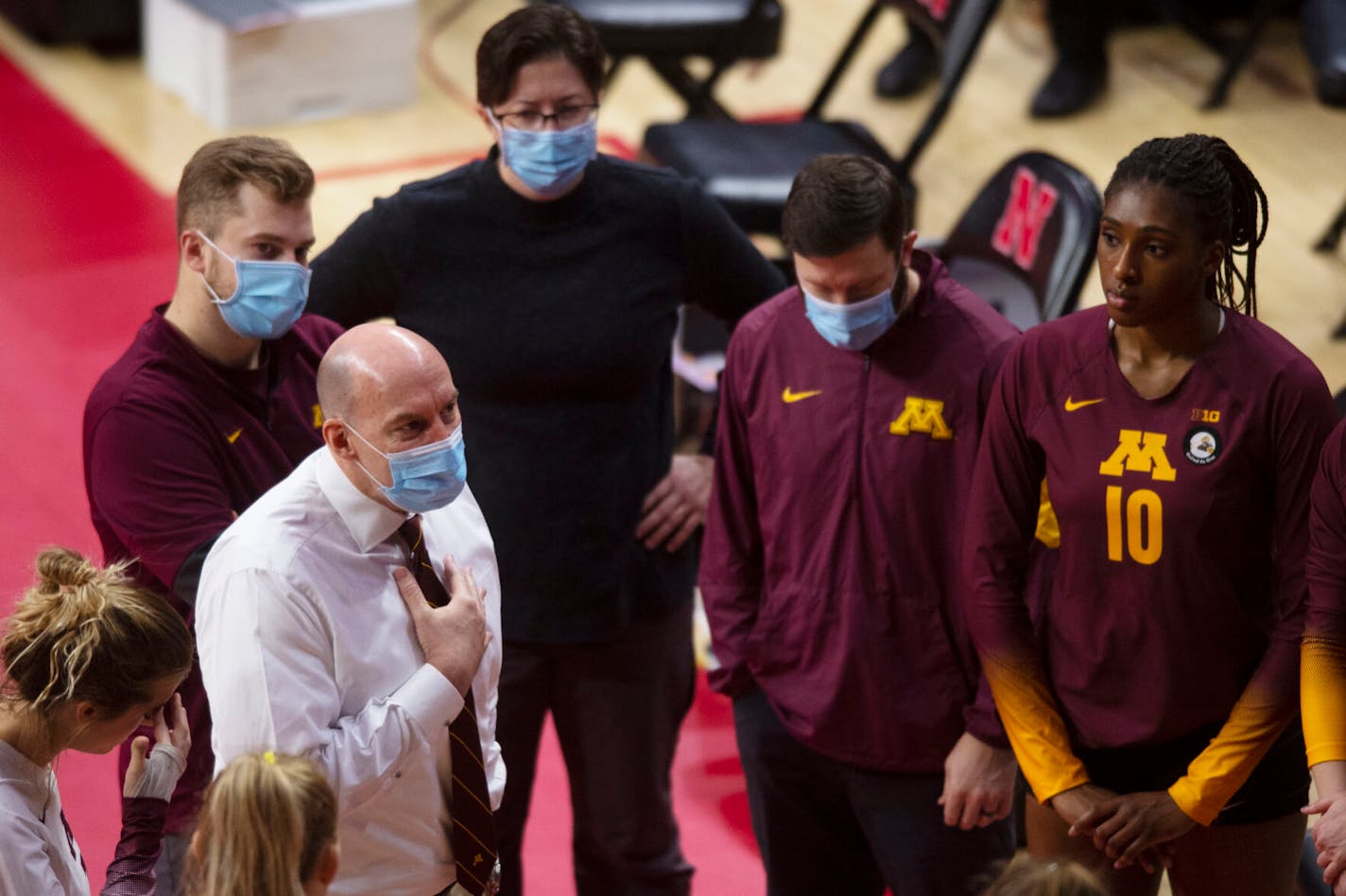 Gophers volleyball coach Hugh McCutcheon speaks to his team before their match against Nebraska on Sunday, Feb. 21, 2021, at the Devaney Sports Center in Lincoln, Neb.