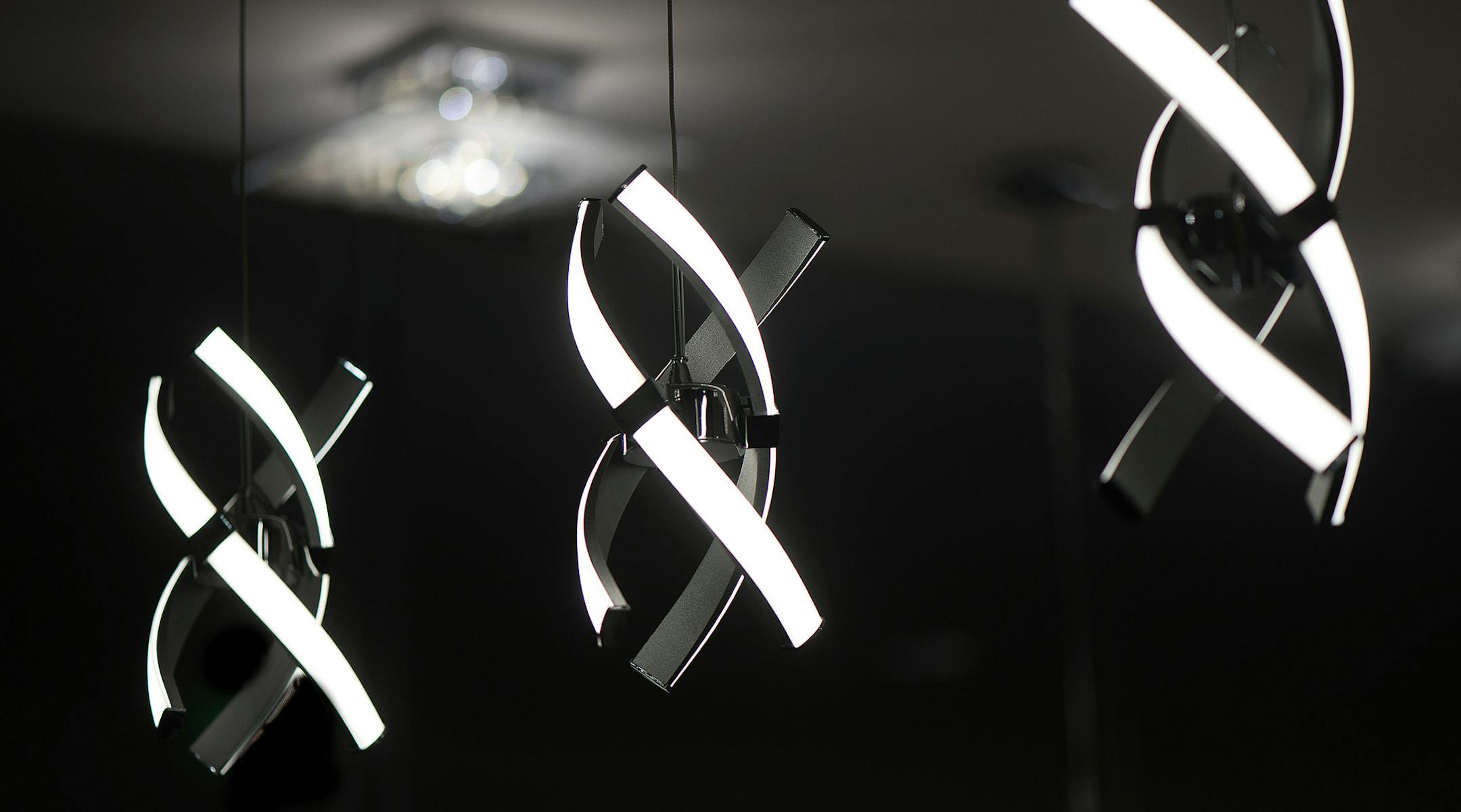 This modern, playful LED trio hang over the front desk at Euro Moda Lighting and Furniture where each piece is carefully, painstakingly placed, according to the Irvine shop's managing director and founding partner, Houman Shir. (Cindy Yamanaka/Orange County Register/TNS) ORG XMIT: 1181819