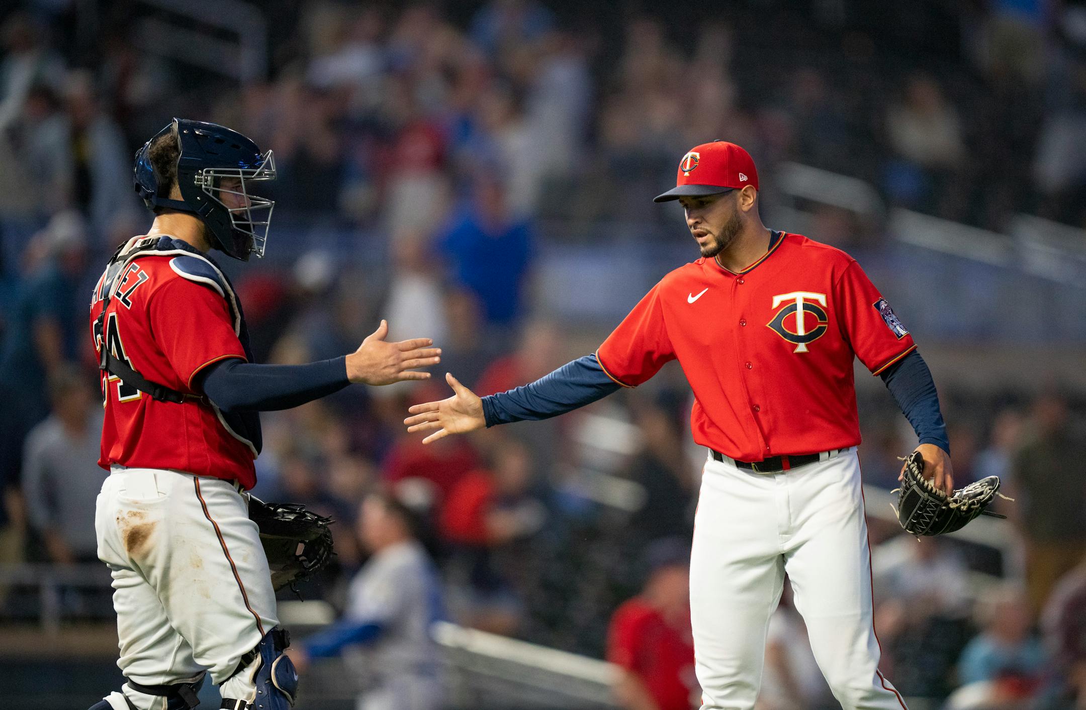 Minnesota Twins relief pitcher Jovani Moran (71) and Minnesota Twins catcher Gary Sanchez (24) celebrated the win afteer Moran struck out Kansas City Royals first baseman Nick Pratto to end the game.