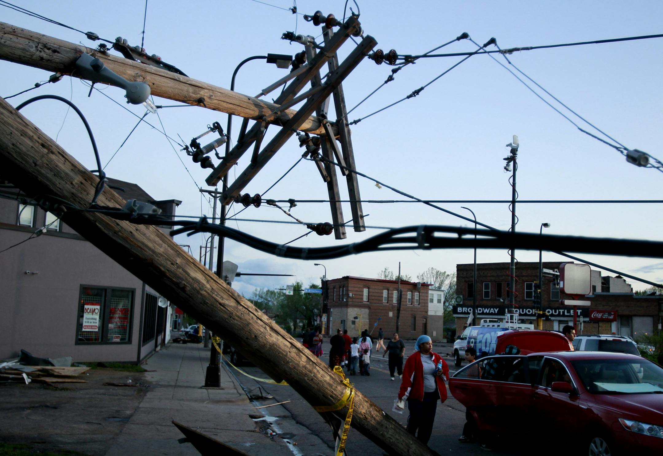 Jerry Holt ‚Ä¢ jgholt@startribune.com Minneapolis , MN 05/22/2011--Storm damage north Minneapolis . ---IN THIS PHOTO ] The street were filled with power lines and debris along Broadway and Penn Avenue's after Sunday's tornado touchdown .