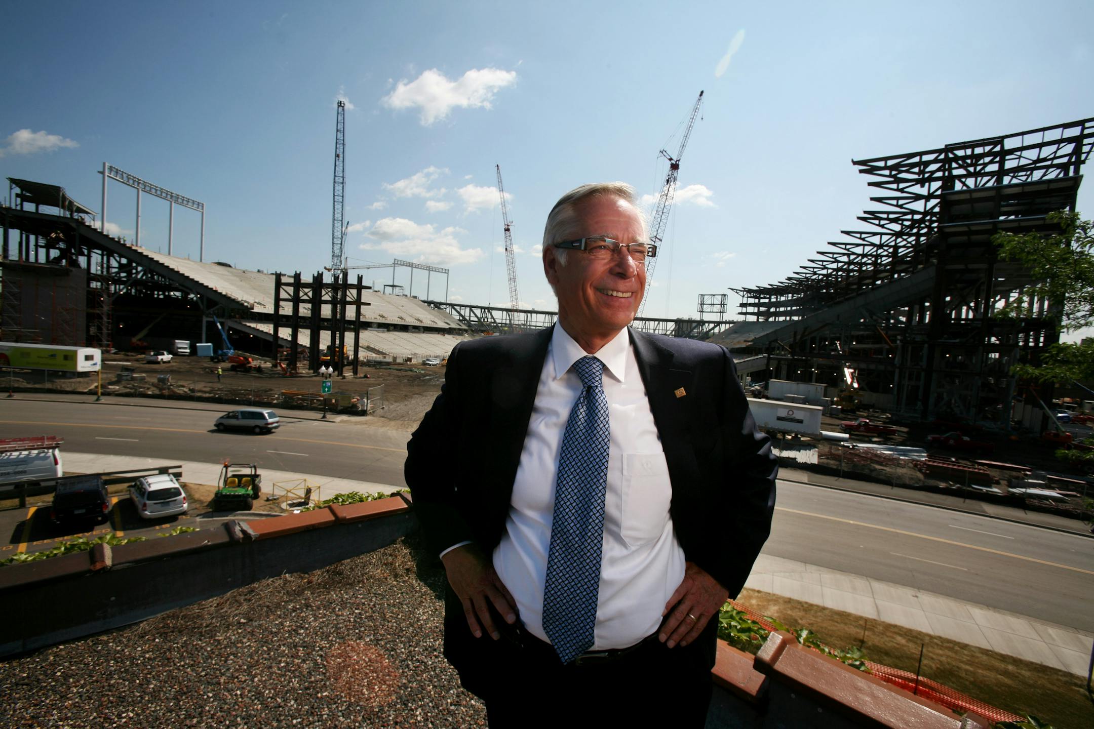 Robert Bruininks next to TCF Bank Stadium during its construction in 2008.