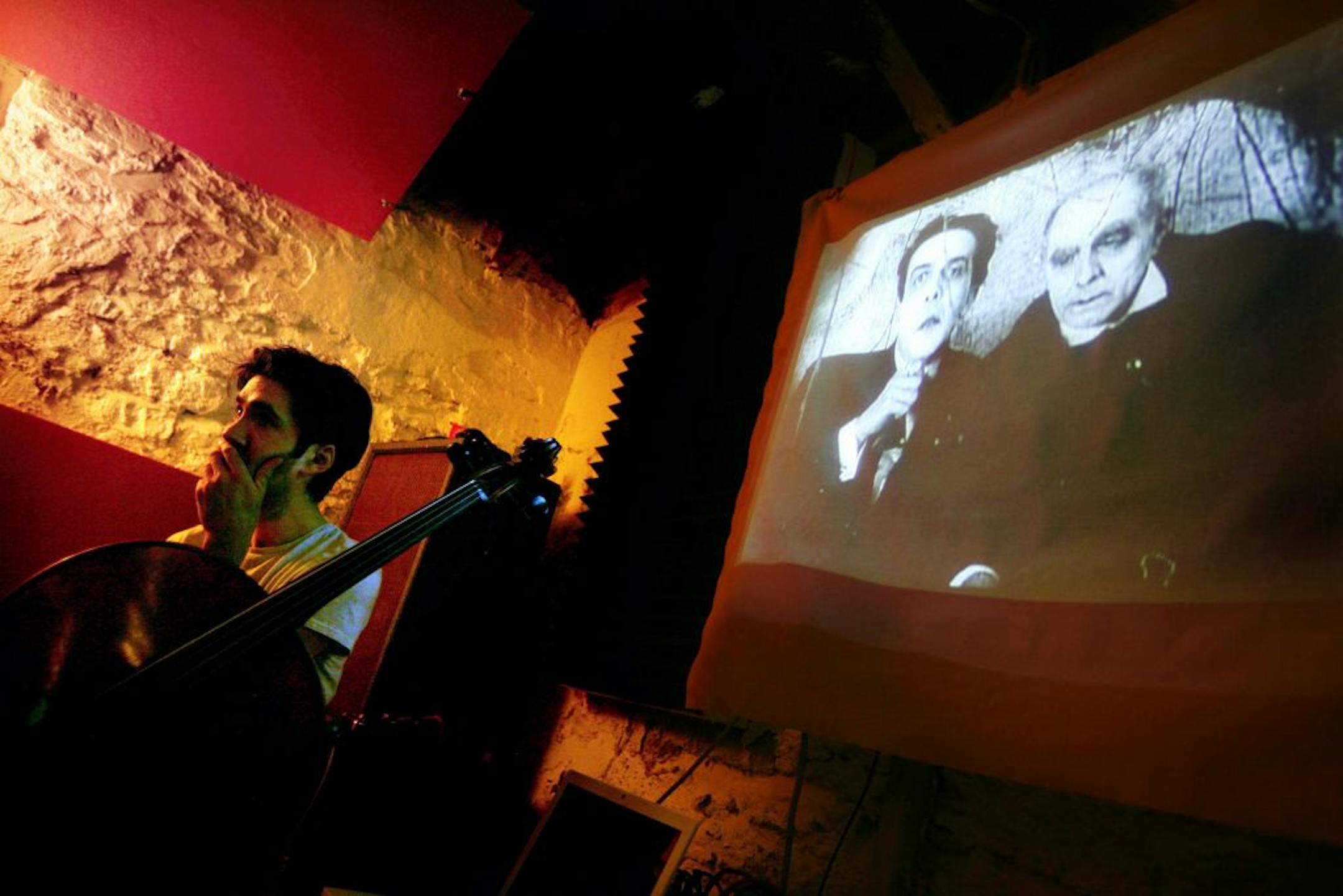 Cellist Jonathan Kaiser watched his Brute Heart bandmates watch "The Cabinet of Dr. Caligari" on the basement wall -- a scene repeated over two months as the band rehearsed its score for Walker Art Center.