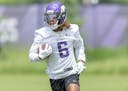 Minnesota Vikings safety Lewis Cine takes to the field for practice at the TCO Performance Center in Eagan, Minn., on Tuesday, May 30, 2023. ] Elizabe
