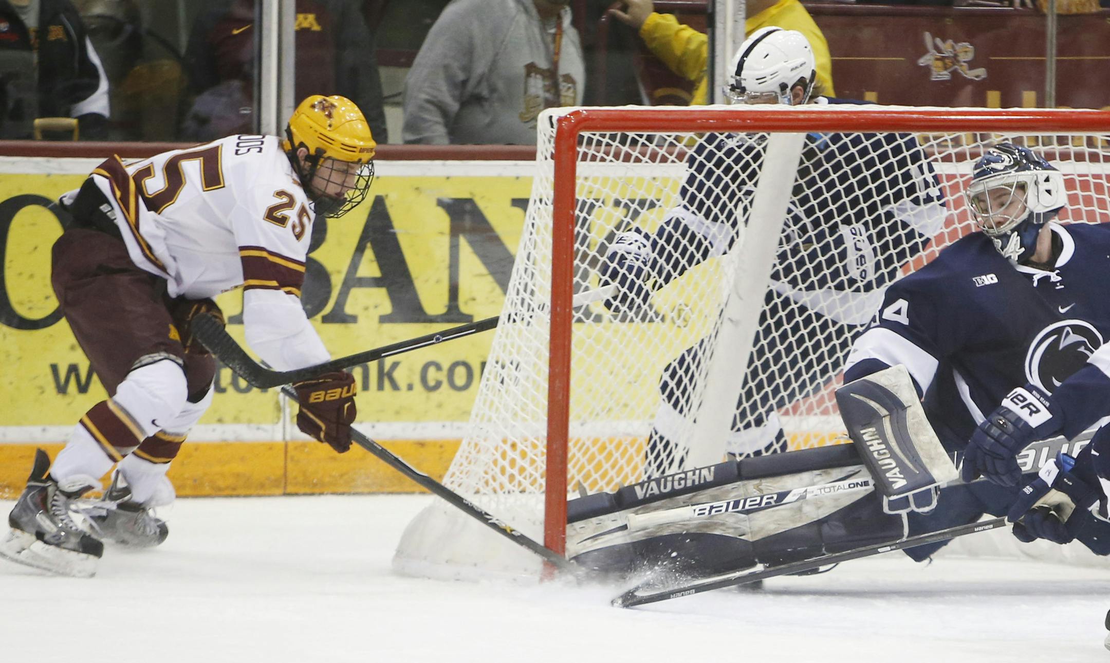 Justin Kloos (25) scores on a wraparound goal on Penn State goalie Eaman McAdam (34) during the first period at Mariucci Arena Friday.