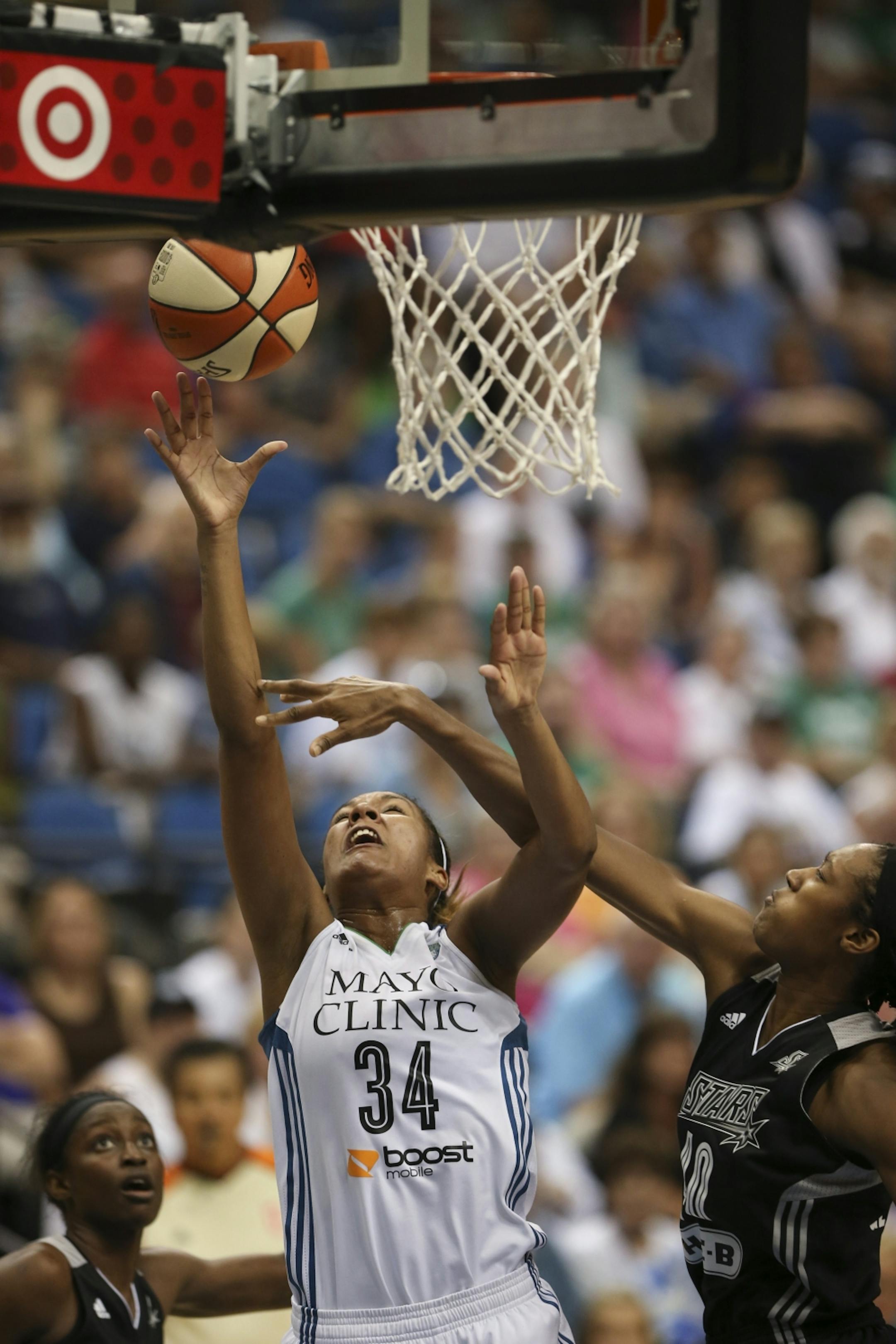 Minnesota's Damiris Dantas took a fourth quarter shot while defended by Kayla Alexander of the Stars Sunday night at Target Center.