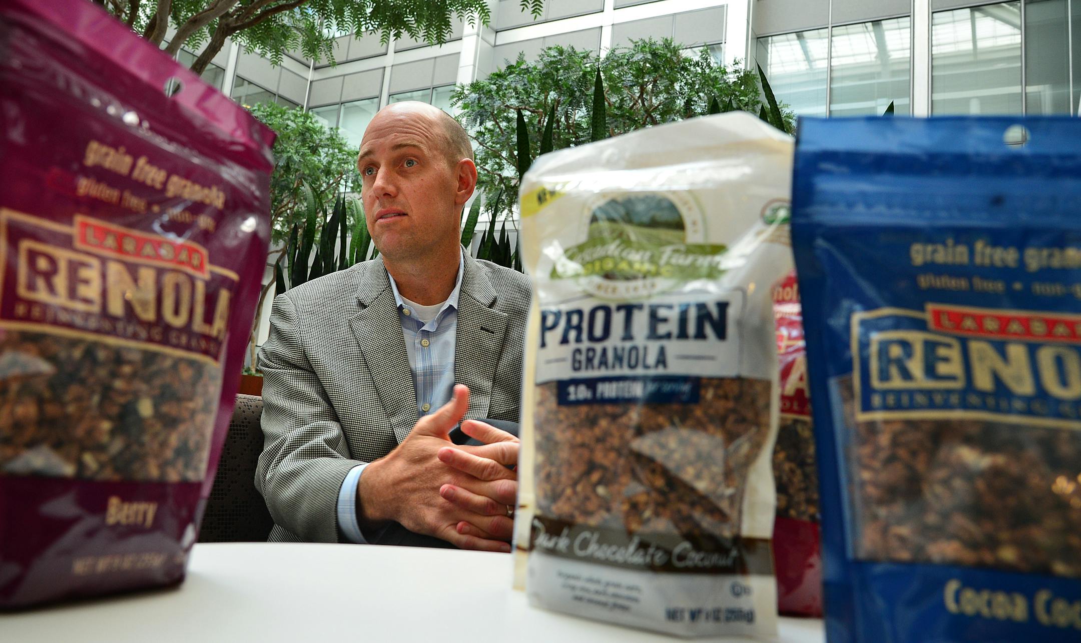 Scott Lee business unit director of the Small Planets Food Division at General Mills. with some of the gluten-free foods ]General Mills is hoping to capitallize on the popularity of protein and gluten-free foods with some of its new products hitting the shelves. One of them is granola without grain, called Renola, and the other is a granola with pea protein. Richard.Sennott@startribune.com Richard Sennott/Star Tribune Golden Valley Minn. Wednesday 7/9/2014) ** (cq)