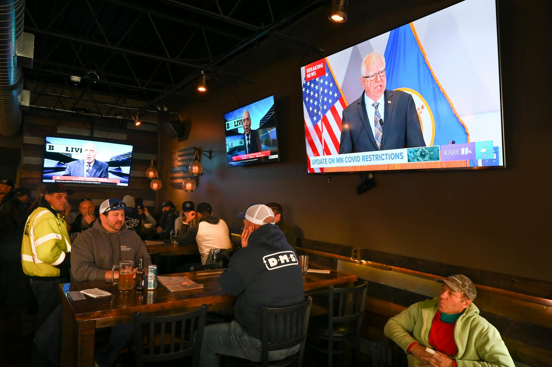 At Alibi Drinkery in Lakeville, Minnesota Gov. Tim Walz's address was broadcast by KARE-11 in the background.