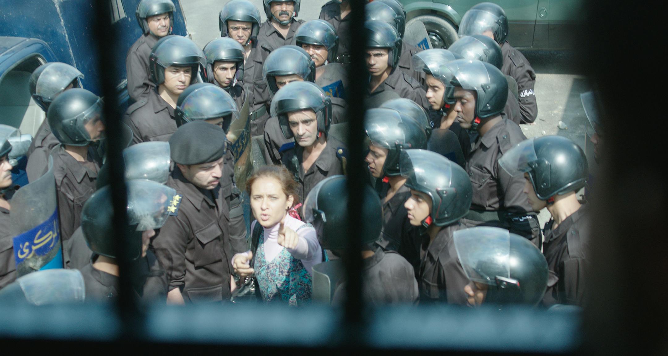 credit Kino Lorber for the images
Clash (Arabic: Eshtebak??) is a 2016 internationally co-produced drama film directed by Mohamed Diab. Set just after the political events of June 2013, the film is shot entirely in the confines of a police van containing Muslim Brotherhood members and pro-army supporters, as well as other people belonging to neither of these factions.