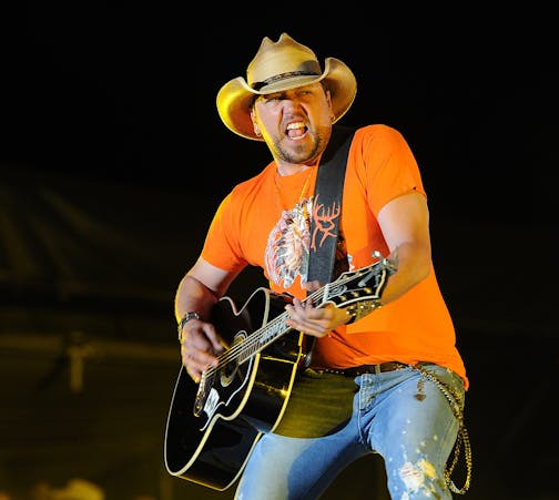 FILE - In this April 26, 2014 file photo, Jason Aldean performs during his headlining set on day two of the 2014 Stagecoach Music Festival at the Empire Polo Field in Indio, Calif. When Jason Brown came to Nashville to start his career as the country artist Colt Ford, he couldn&#xed;t find songwriters that would write for his singing style, an open embrace of hip-hop beats and rhythms with his spoken word or rapping lyrics, but with a clearly country theme. Aldean tried his hand at rapping on on