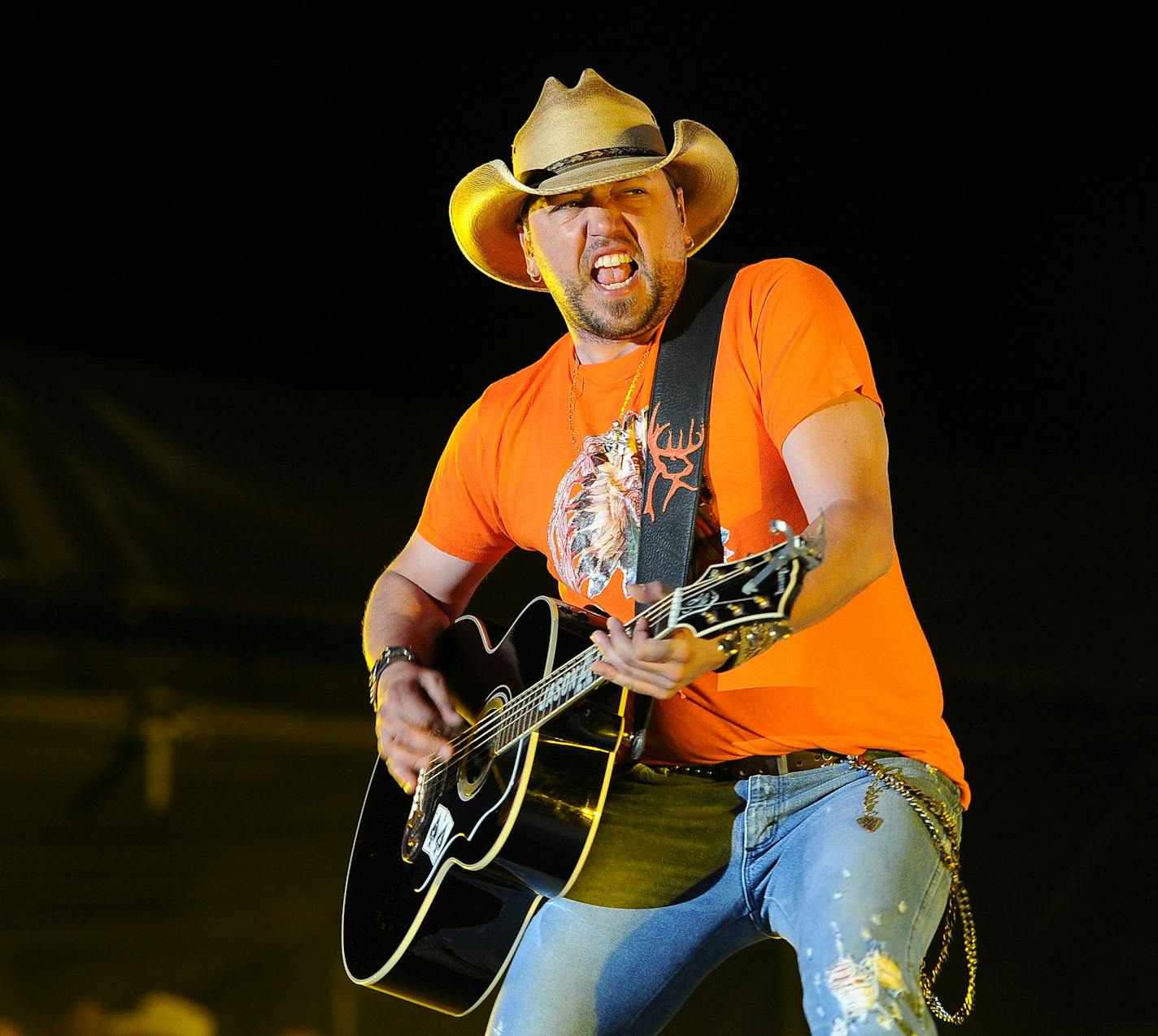 FILE - In this April 26, 2014 file photo, Jason Aldean performs during his headlining set on day two of the 2014 Stagecoach Music Festival at the Empire Polo Field in Indio, Calif. When Jason Brown came to Nashville to start his career as the country artist Colt Ford, he couldn&#xed;t find songwriters that would write for his singing style, an open embrace of hip-hop beats and rhythms with his spoken word or rapping lyrics, but with a clearly country theme. Aldean tried his hand at rapping on on