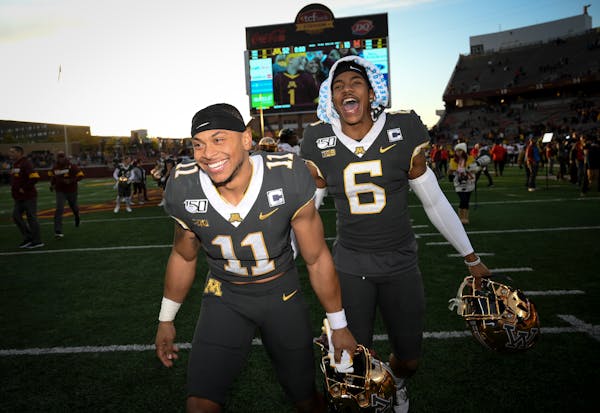 Gophers defensive backs Antoine Winfield Jr. and Chris Williamson celebrated following their 52-10 victory over Maryland on Saturday night.
