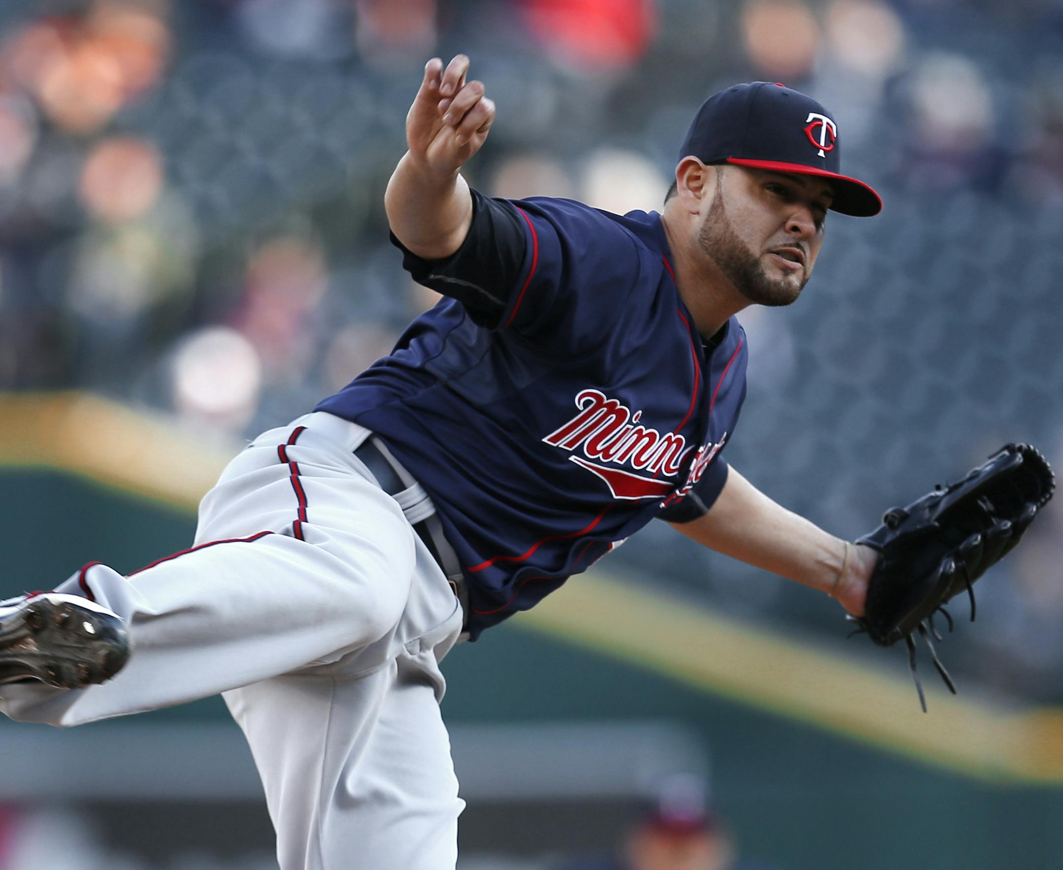 Minnesota Twins pitcher Ricky Nolasco watches a delivery to the Detroit Tigers during the first inning of a baseball game in Detroit on Wednesday, May 13, 2015. (AP Photo/Paul Sancya)