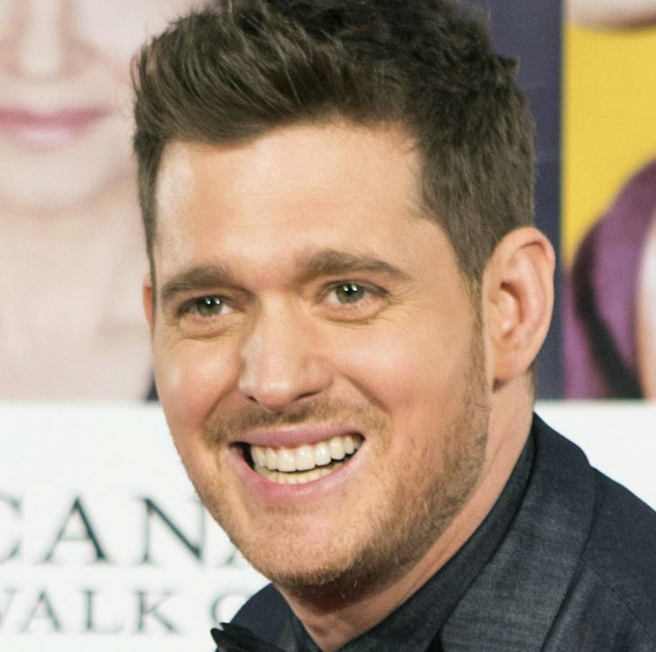 Michael Buble signs his plaque as he in inducted into Canada's Walk of Fame during an event in Toronto, Saturday, Nov. 7, 2015. (Chris Young/The Canadian Press via AP) MANDATORY CREDIT
