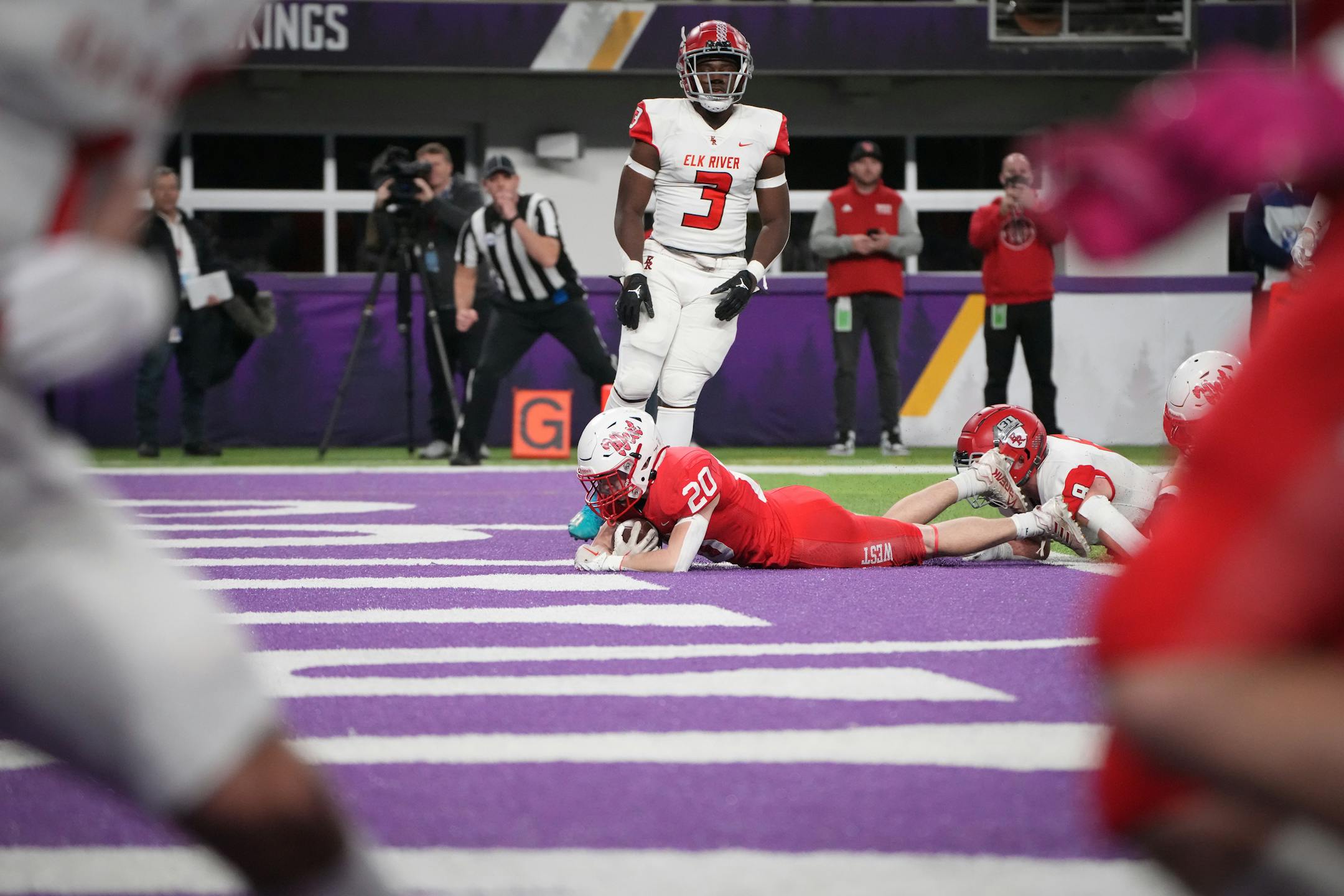 Mankato West's Jackson Froderman (20) falls into the endzone for a touchdown against Elk River in the first half of the Minnesota High School football Class 5A State Championship at U.S. Bank Stadium in Minneapolis, Minn., on Saturday, Dec. 3, 2022.
