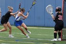 Blake attacker Erin Lee works her way to the goal in a 15-10 victory over Eden Prairie on 5/22/2021