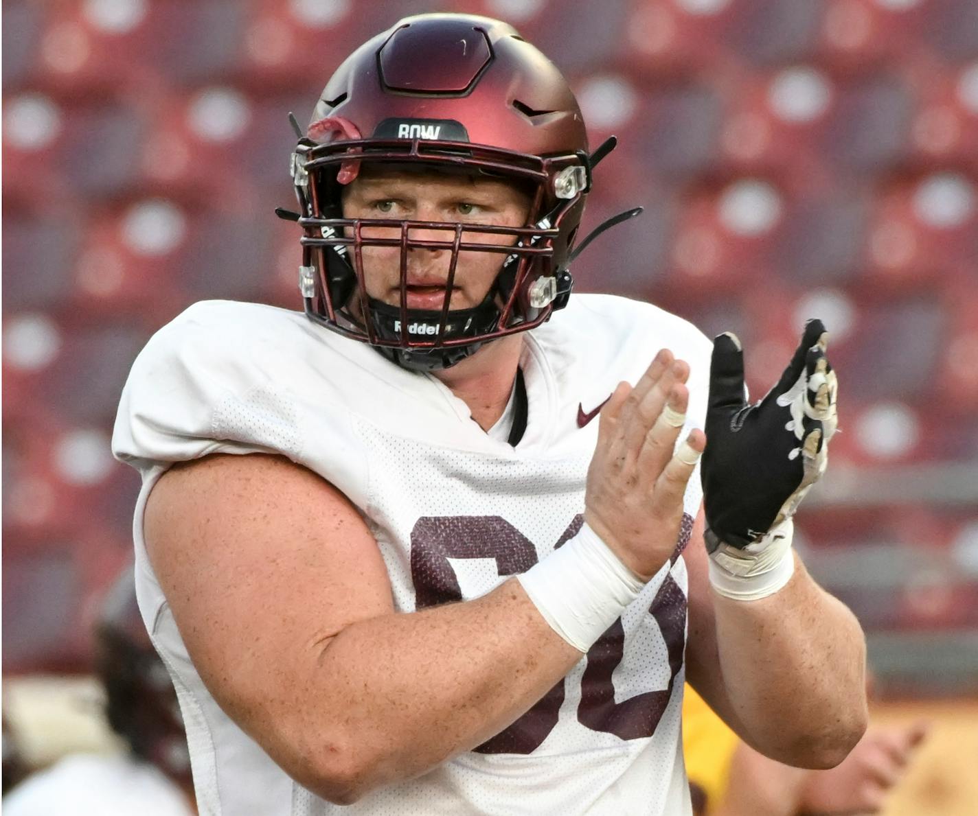 Minnesota Golden Gophers offensive lineman John Michael Schmitz (60) claps during a Minnesota Gophers open football practice Thursday, Aug. 11, 2022 at Huntington Bank Stadium in Minneapolis, Minn.. ] aaron.lavinsky@startribune.com ORG XMIT: MIN2208112050170121