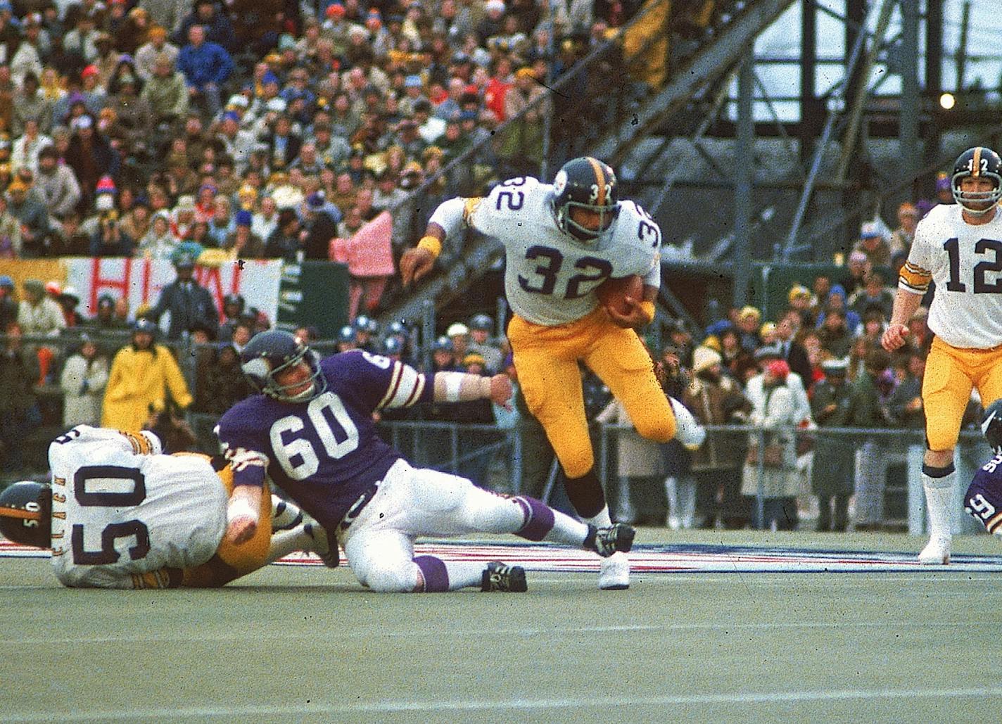 Pittsburgh Steelers running back Franco Harris, (32), tries for some extra yardage during Super Bowl IX against the Minnesota Vikings in New Orleans, LA., on January 12, 1975. (AP Photo) ORG XMIT: APHS104