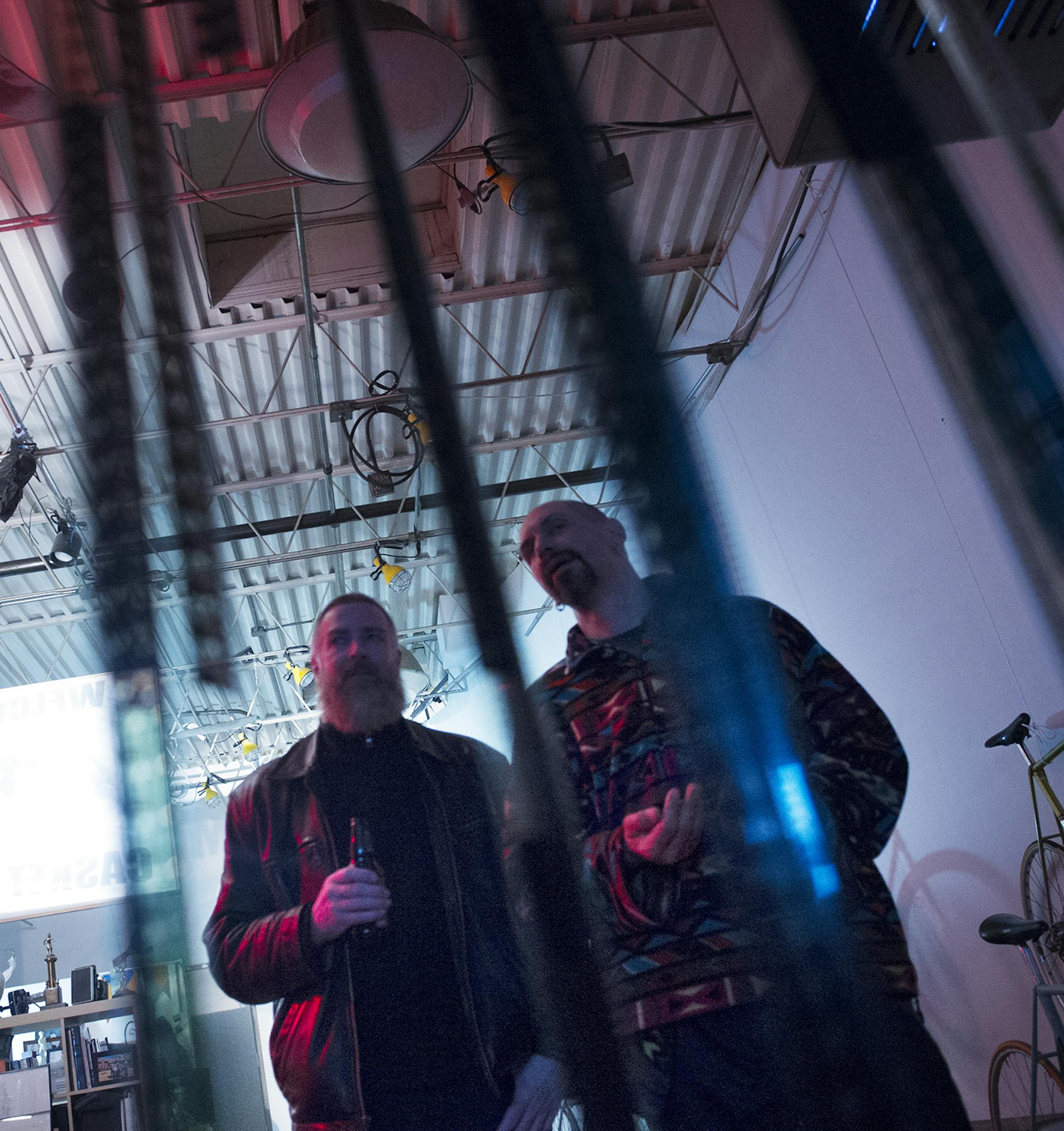 Kenton Hanson, left, and Wilbur Ince, watch a screening of Fixation, a documentary about fixed gear bicycle, at the Casket Cinema in Minneapolis, Wednesday, March 6th, 2014. ] (Matthew Hintz, 030614, Minneapolis)