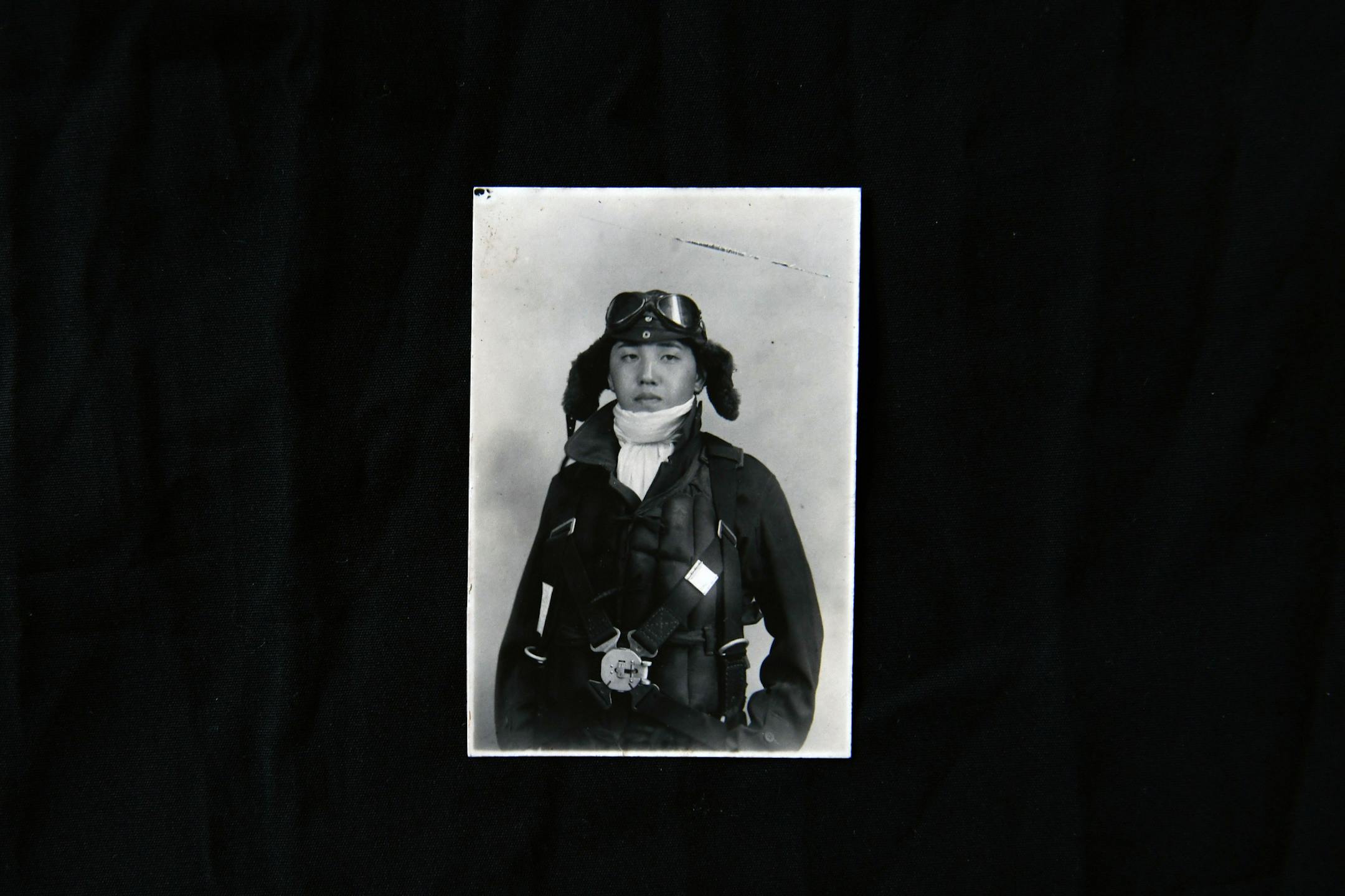 A portrait of Kazuo Odachi at age 18, in his pilot uniform, is displayed at his home in Tokyo on Sept. 7, 2020. Odachi has written a book about his time as a Japanese Navy pilot, "Memoirs of a Kamikaze."