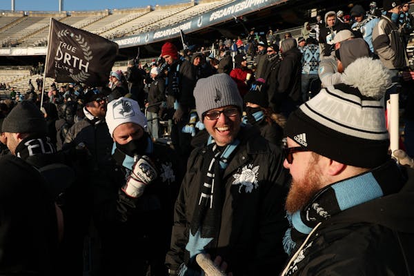 Minnesota United fans stood bundled up in the stands prior to the start of the first half.