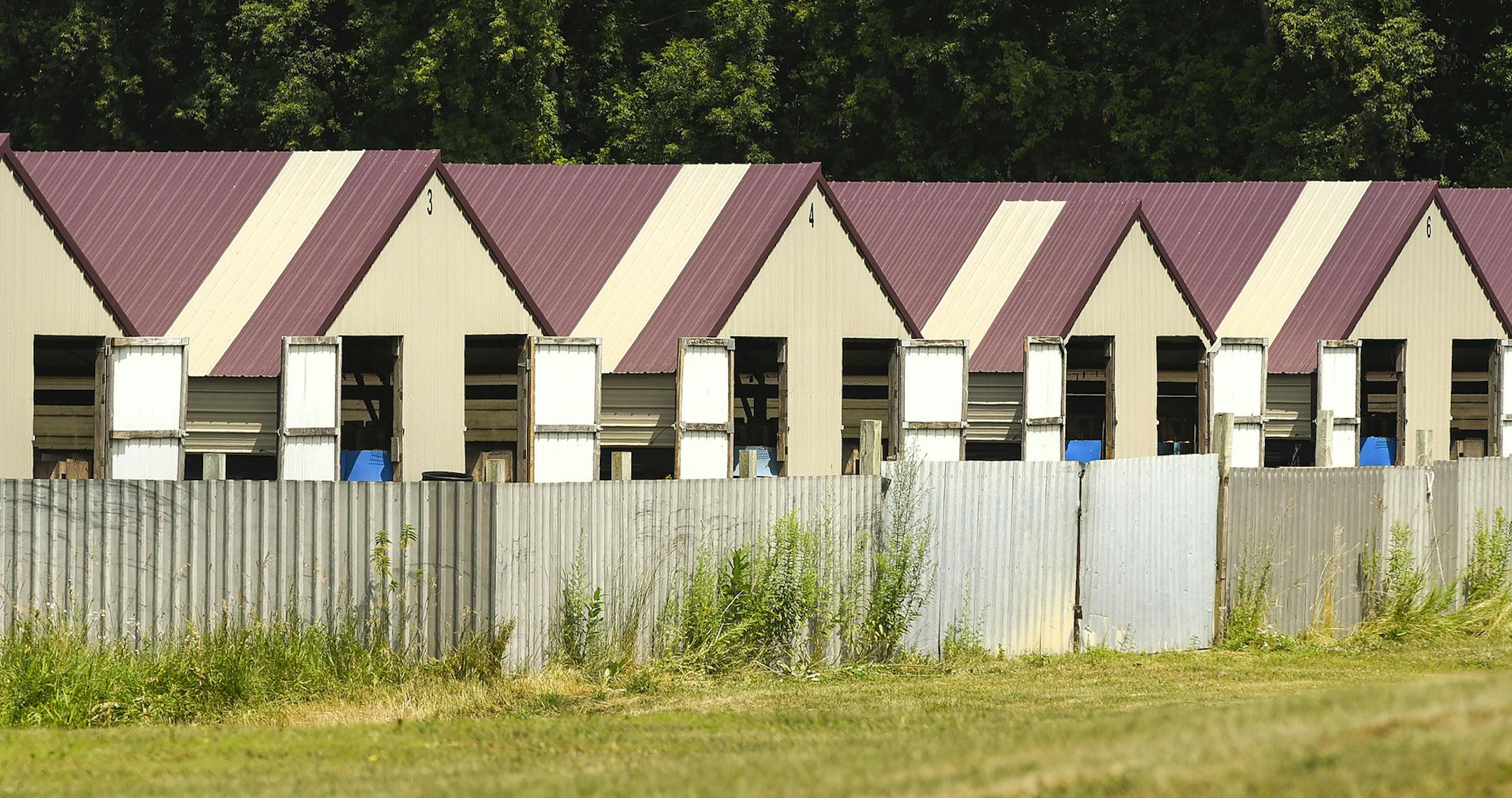 Lang Farms, near Eden Valley, Minn., where vandals dismantled a fence and released late Sunday or early Monday mink from the farm into the wild, Tuesday, July 18, 2017. Authorities say they believe animal rights activists set free from a pelt farm in central Minnesota about 35,000 mink incapable of surviving in the wild. (Jason Wachter/St. Cloud Times via AP) ORG XMIT: MIN2017072015495353