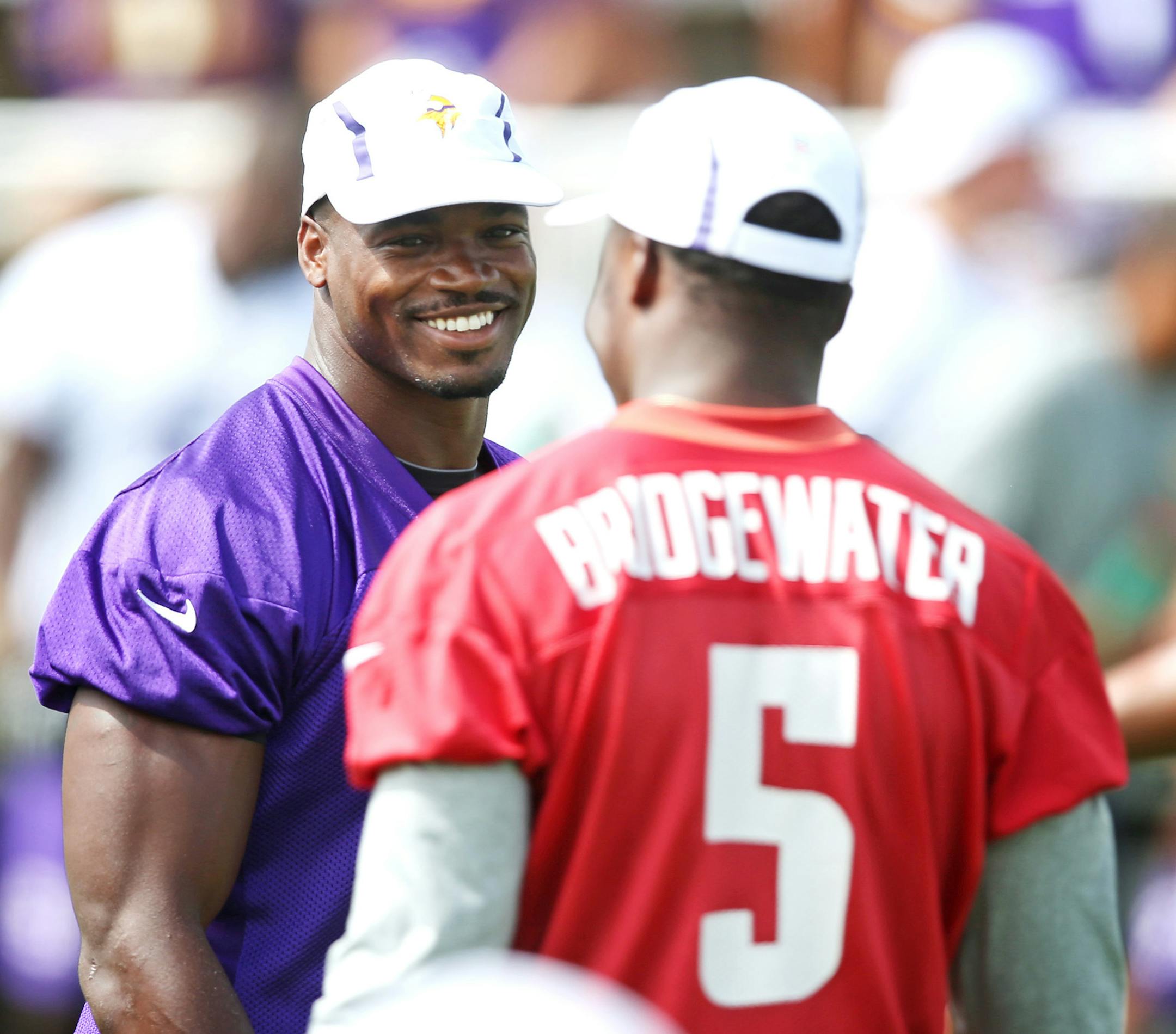 Adrian Peterson left and Teddy Bridgewater chatted during the morning walk through practice at Minnesota State University Vikings training camp Sunday July 26, 2015 in Mankato, MN. Jerry Holt/ Jerry.Holt@Startribune.com