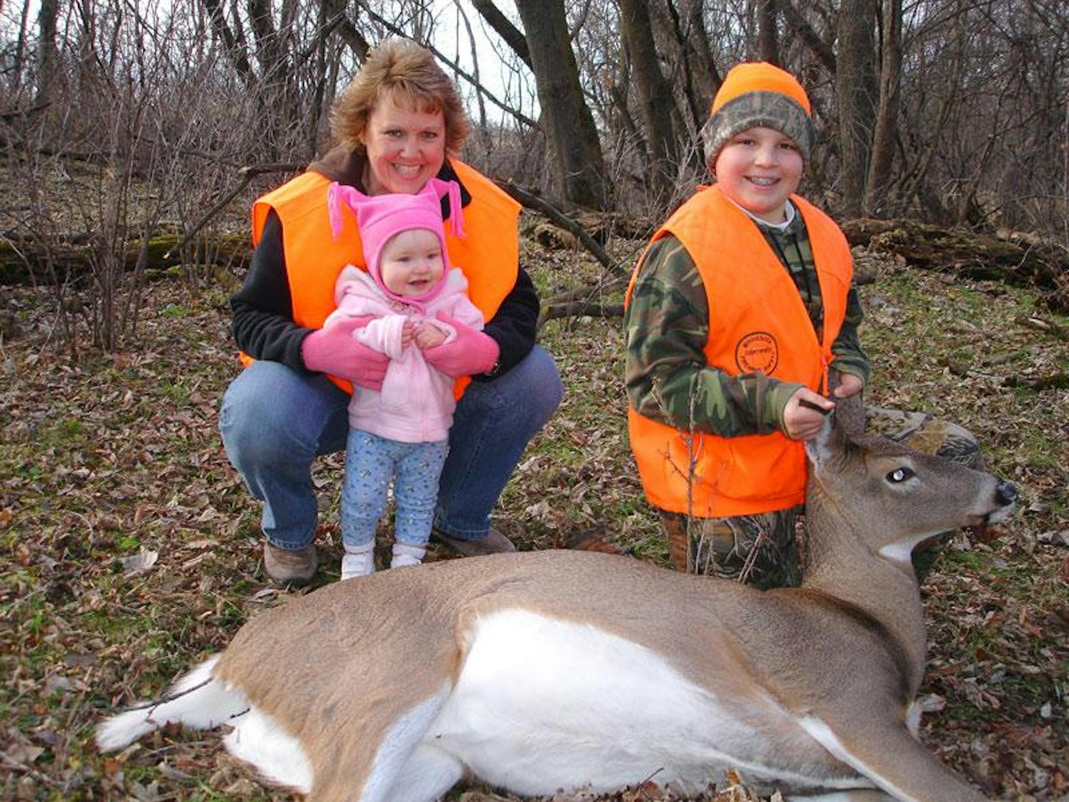 The author's stepson shares the excitement of his "first deer" with his mother and little sister.
