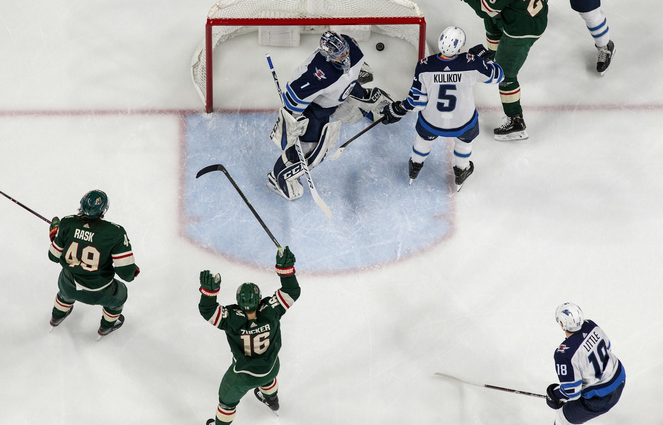 Wild players celebrated a goal by Zach Parise (11) in the first period.
