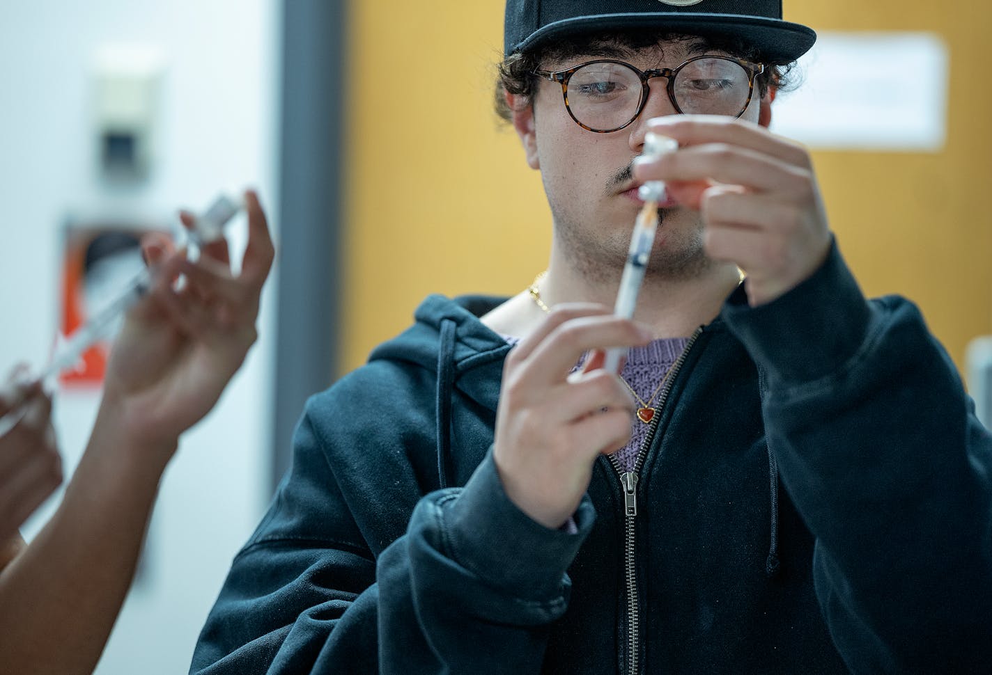 Washington Technology Magnet School senior Jorge Vargas learns how to administer an injectable naloxone during his class in St. Paul, Minn., on Thursday, Jan. 11, 2024. Vargas was the student that recommended having training at the school. ] Elizabeth Flores • liz.flores@startribune.com