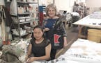 Gladys Zhagui, seated, and Nora Norby, president of Banner Creations, in the company&#x2019;s northeast Minneapolis workroom.