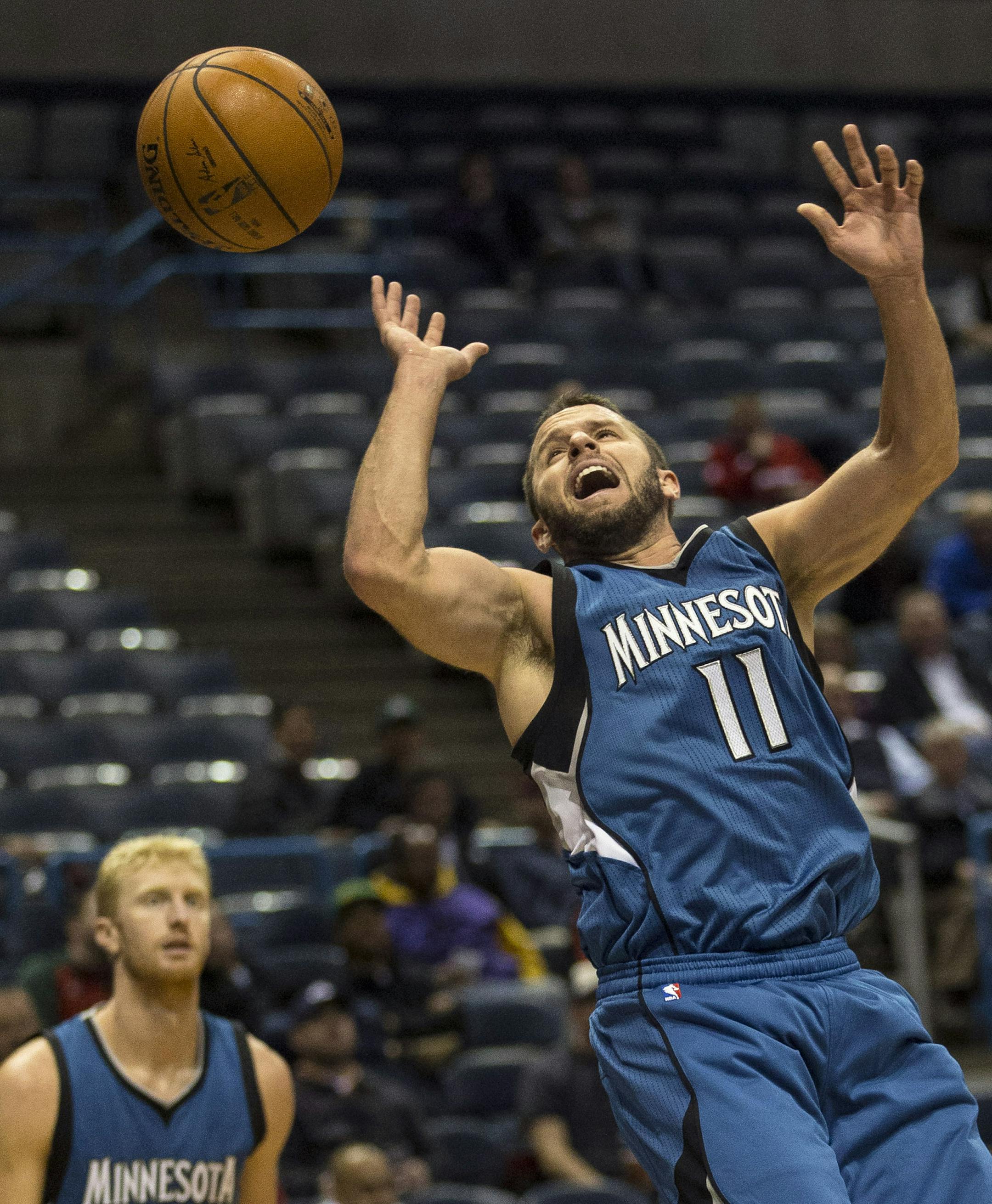 Minnesota Timberwolves' J.J. Barea (11) has the ball knocked him by a Milwaukee Bucks' defender during the second half of an NBA basketball game Wednesday, Oct. 22, 2014, in Milwaukee. (AP Photo/Tom Lynn)