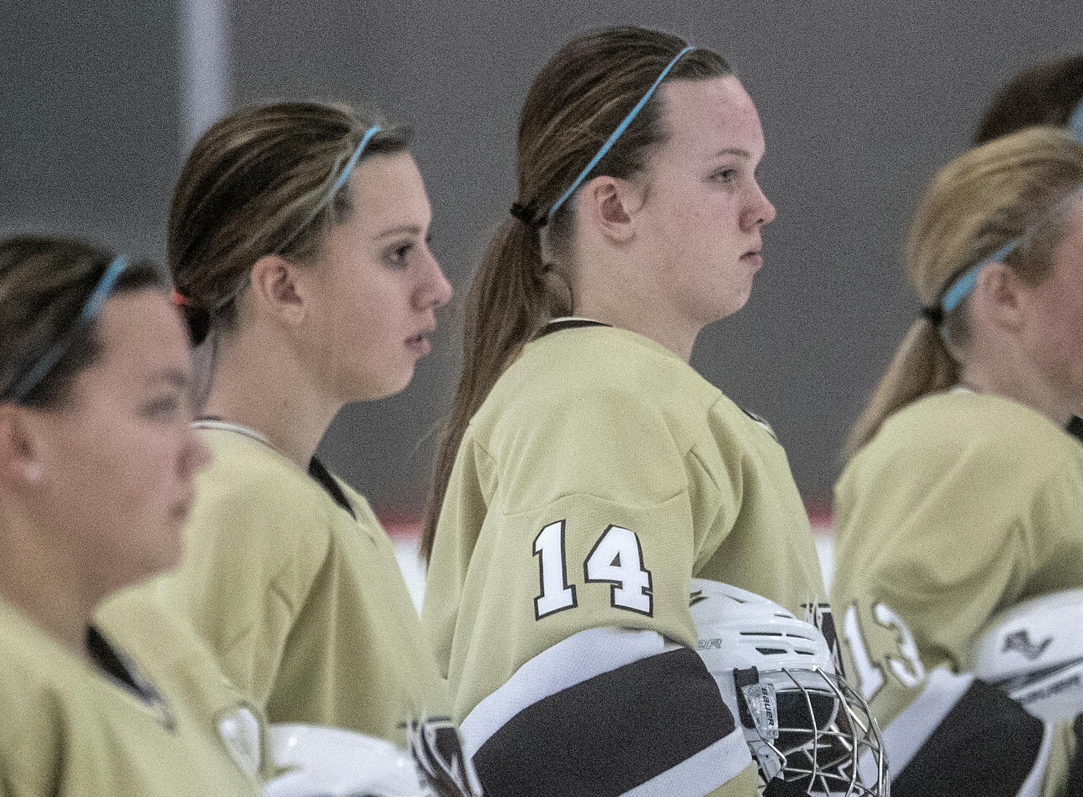 Marie Moran (15) and Mandy Moran (14) of Apple Valley stood at attention during the national anthem before a game against Simley on Jan. 21 at Eagan Civic Arena. Along with seventh-grade sister Marie, they play on the same line and lead the Eagles in scoring. Photo: CARLOS GONZALEZ • cgonzalez@startribune.com