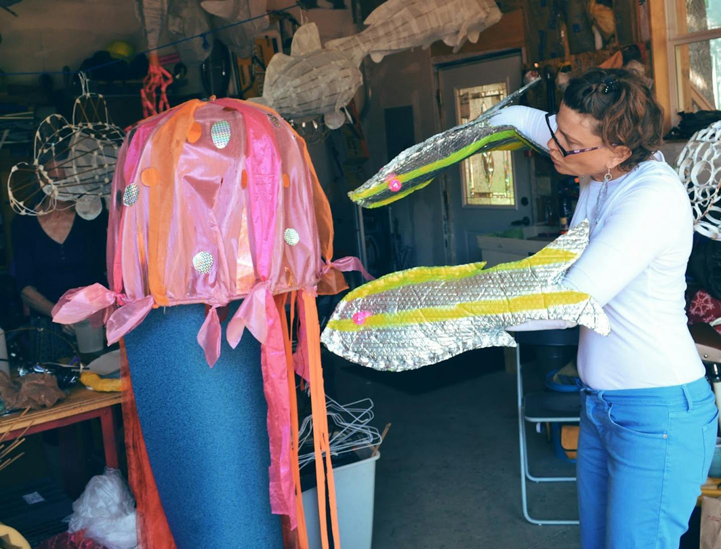 Mina Leierwood demonstrates how the public can participate in the "Illuminated Reef" at the 2016 Northern Spark.