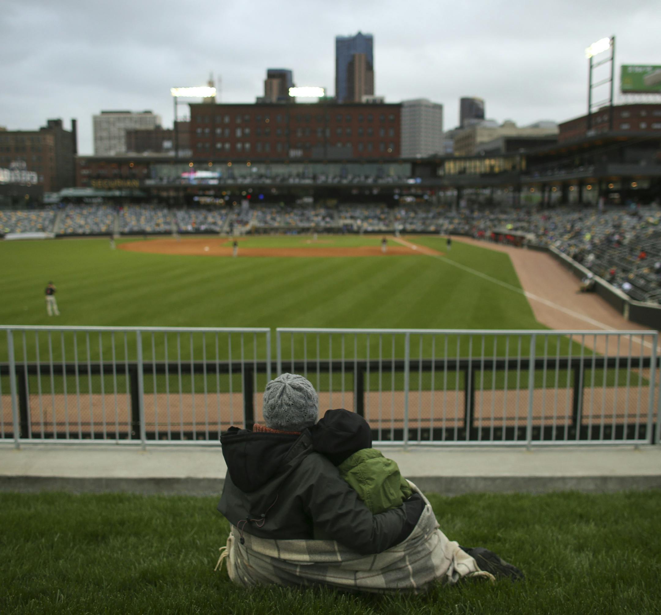 Nissa Ulven and her son, Max, 8, took in the game from the berm in left field Monday night. “This is awesome,” Ulven said. “That’ll be our future.”.