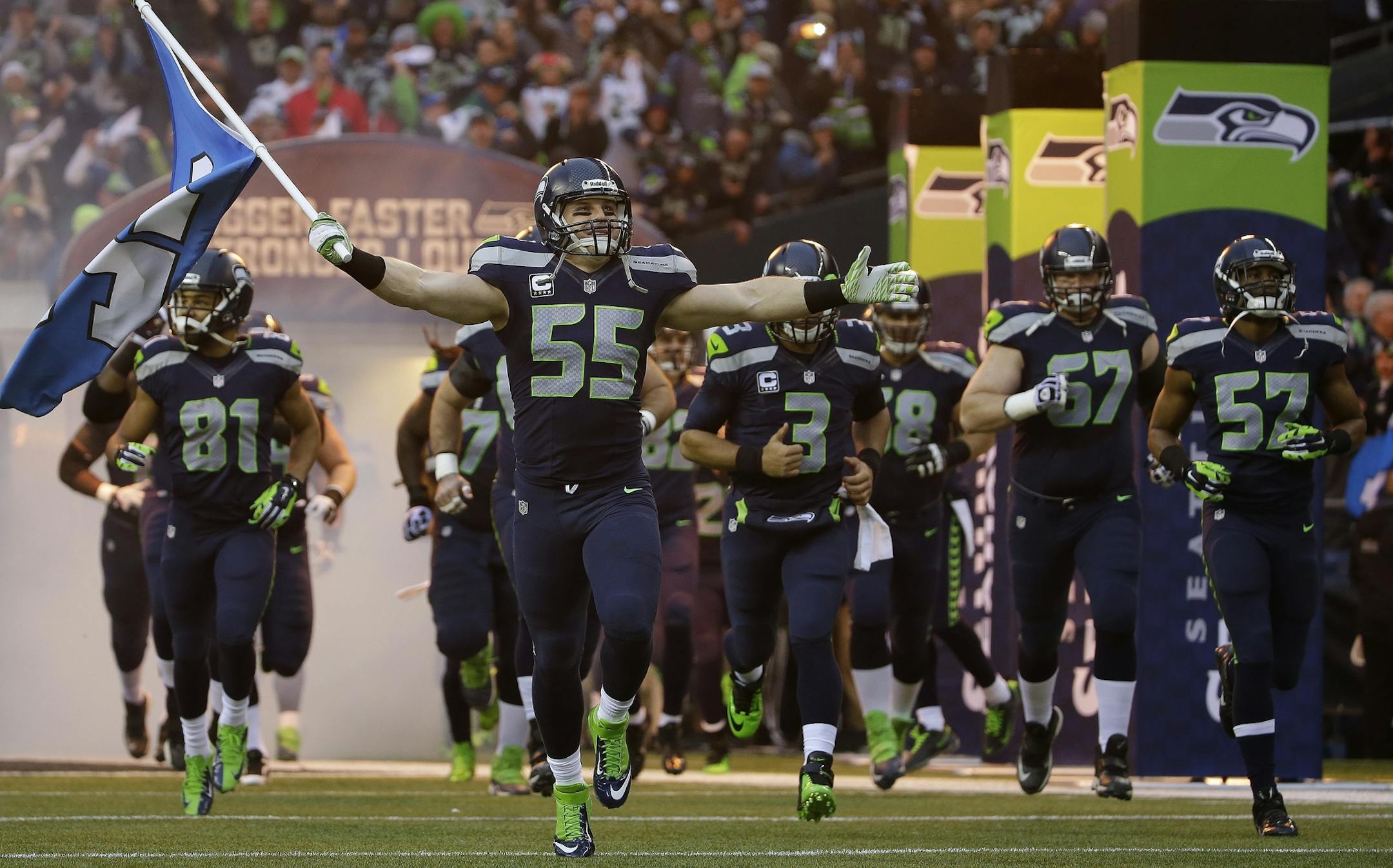 Seattle Seahawks' Heath Farwell leads his team onto the field during the first half of the NFL football NFC Championship game against the San Francisco 49ers Sunday, Jan. 19, 2014, in Seattle. (AP Photo/Matt Slocum) ORG XMIT: MIN2014012919052140