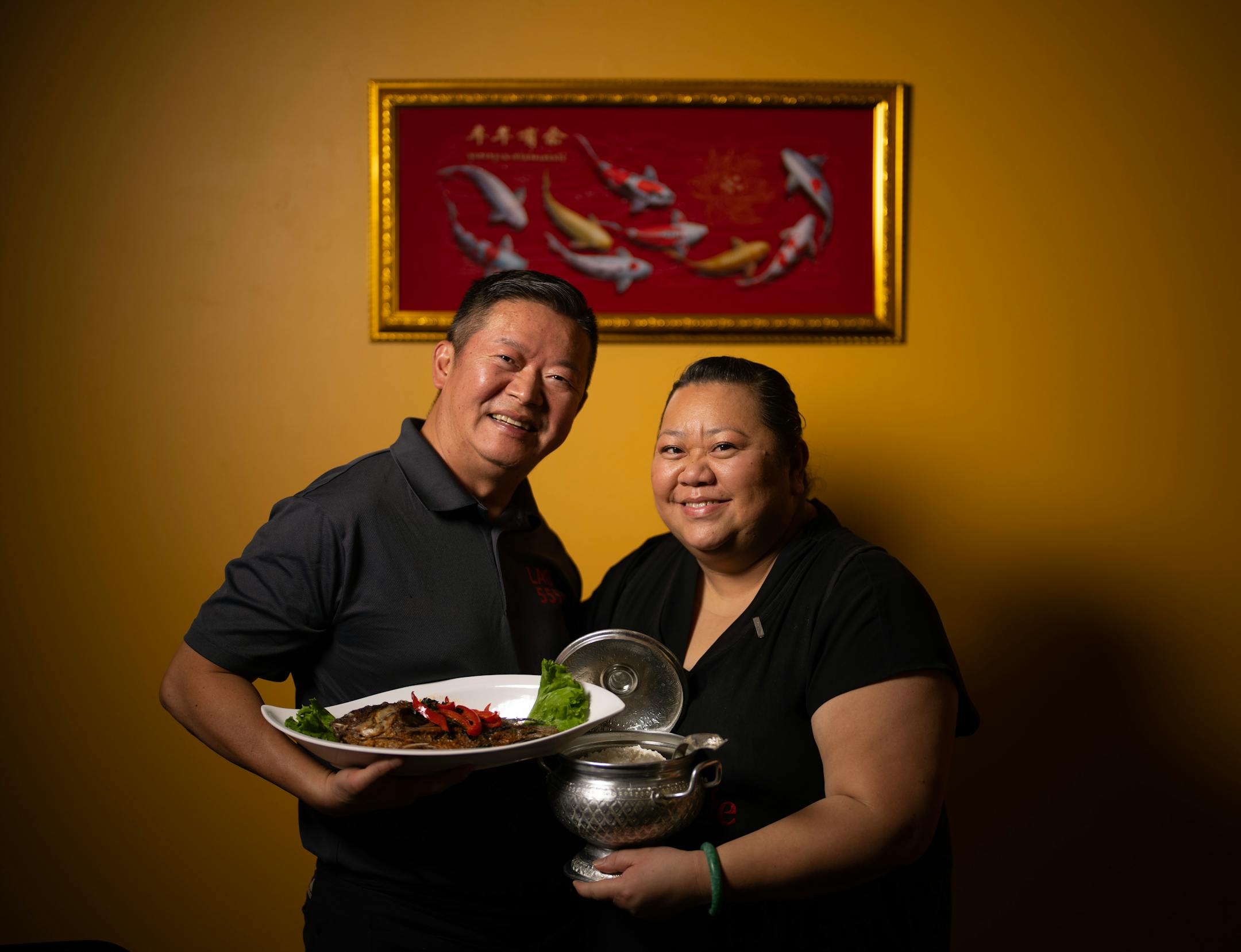 Thai Cafe's Lao Vue with his wife, chef Lynn Her and their Curry fried fish, which is a deep fried whole tilapia covered in a red curry sauce with bell peppers, sweet basil, and kaffir lime leaves.
