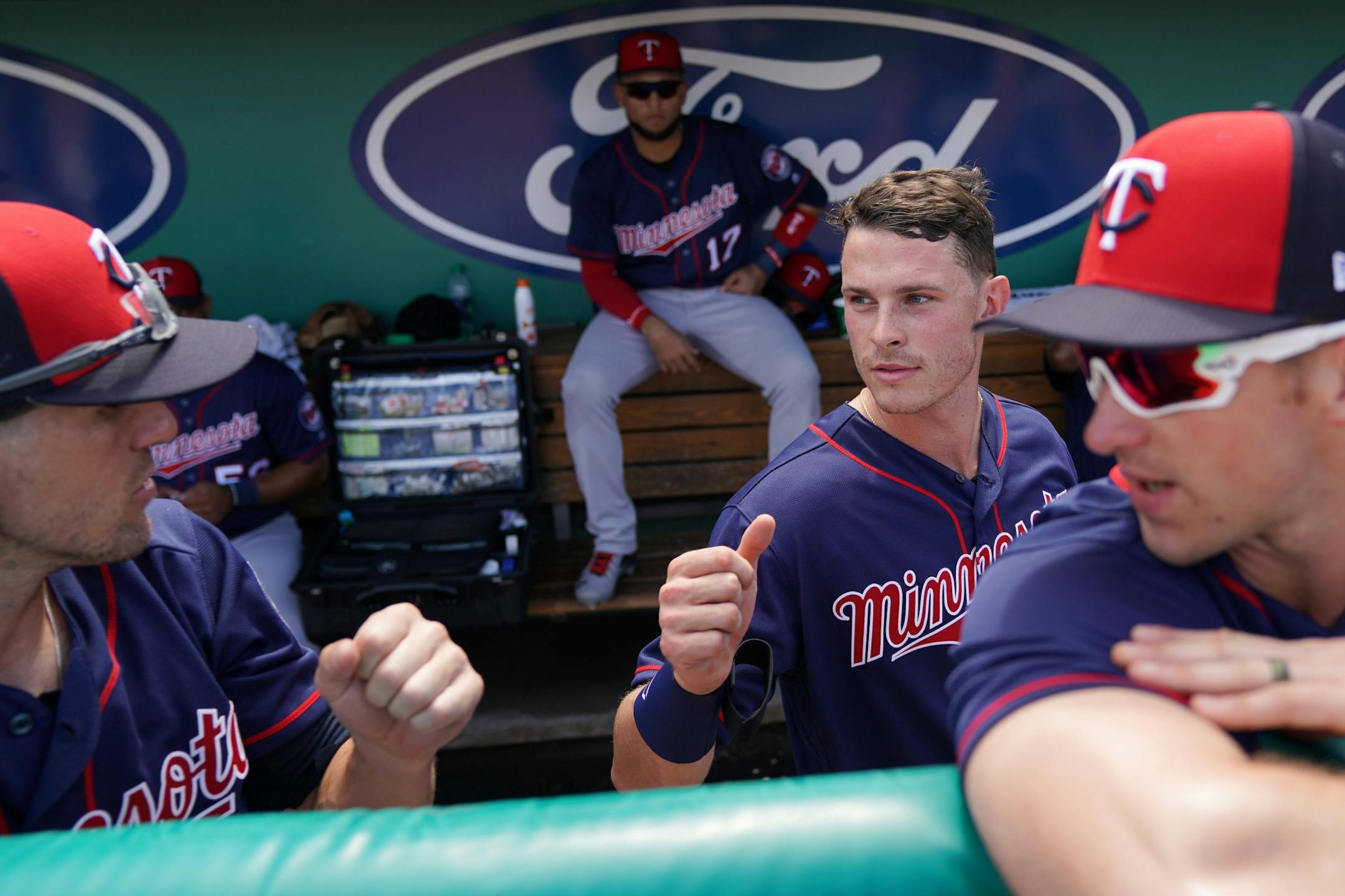 Minnesota Twins right fielder Max Kepler (26) fist bumped his teammates in the dugout before Sunday's game.