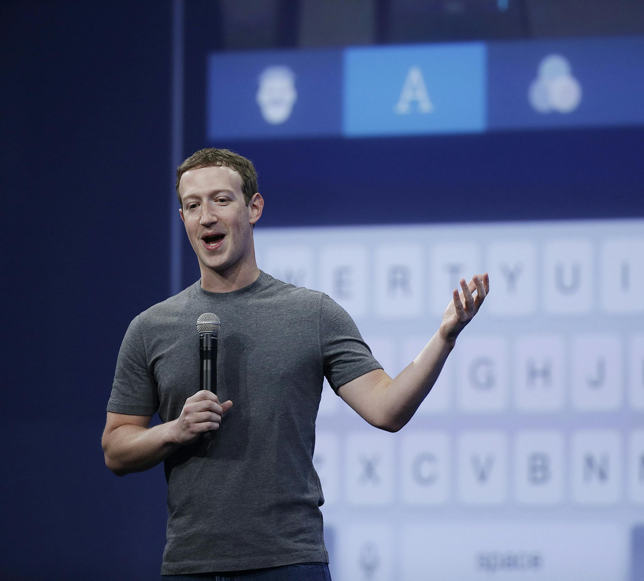 CEO Mark Zuckerberg talks about the Messenger app during the Facebook F8 Developer Conference Wednesday, March 25, 2015, in San Francisco. Facebook is trying to mold its Messenger app into a more versatile communications channel as smartphones create new ways for people to connect with friends and businesses beyond the walls of the company's ubiquitous social network. (AP Photo/Eric Risberg)